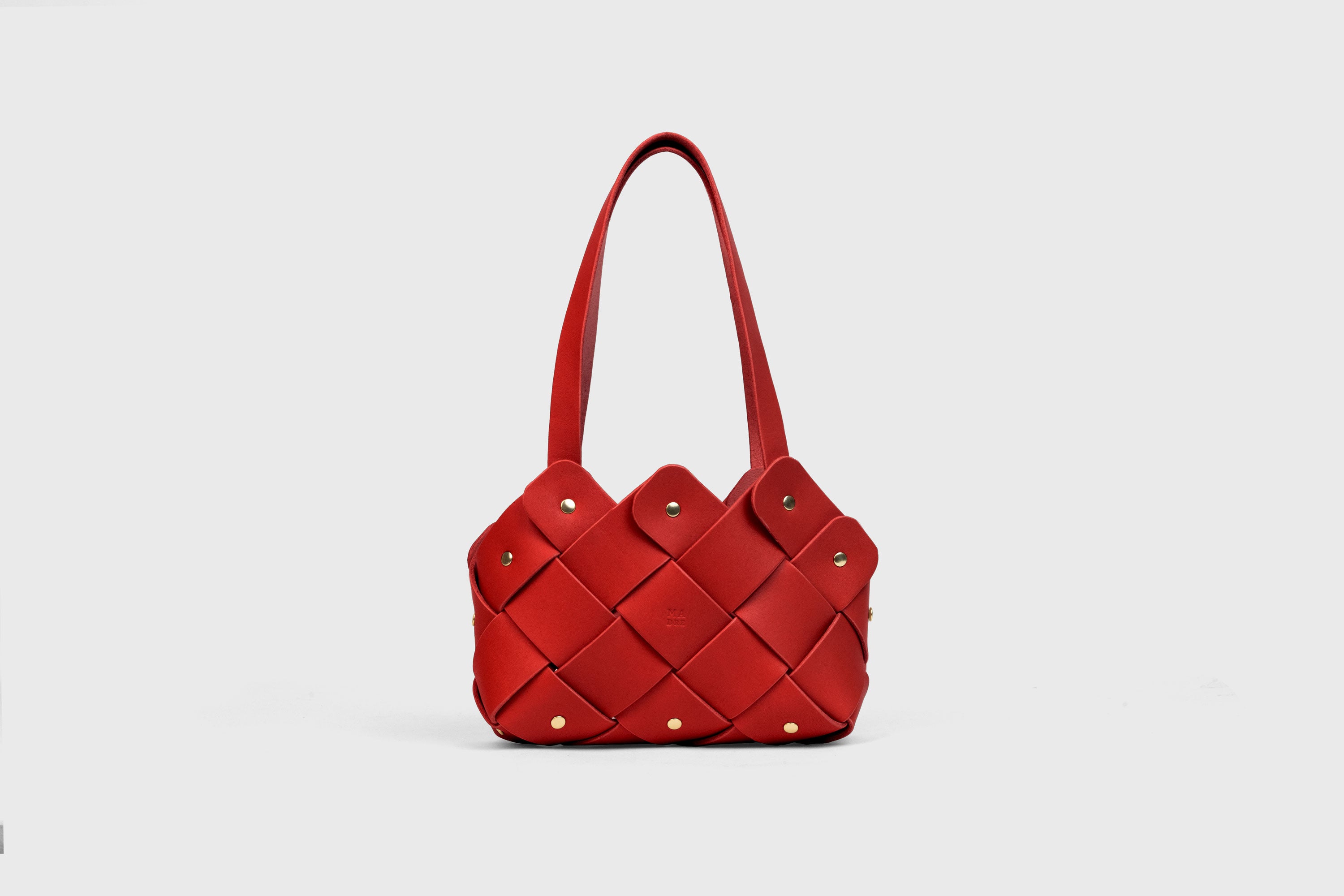 Pine Mini Tote Bag In Red Color In Vegetable Tanned Leather Woven Technique and Brass Rivets Atelier Madre Manuel Dreesmann Barcelona Spain