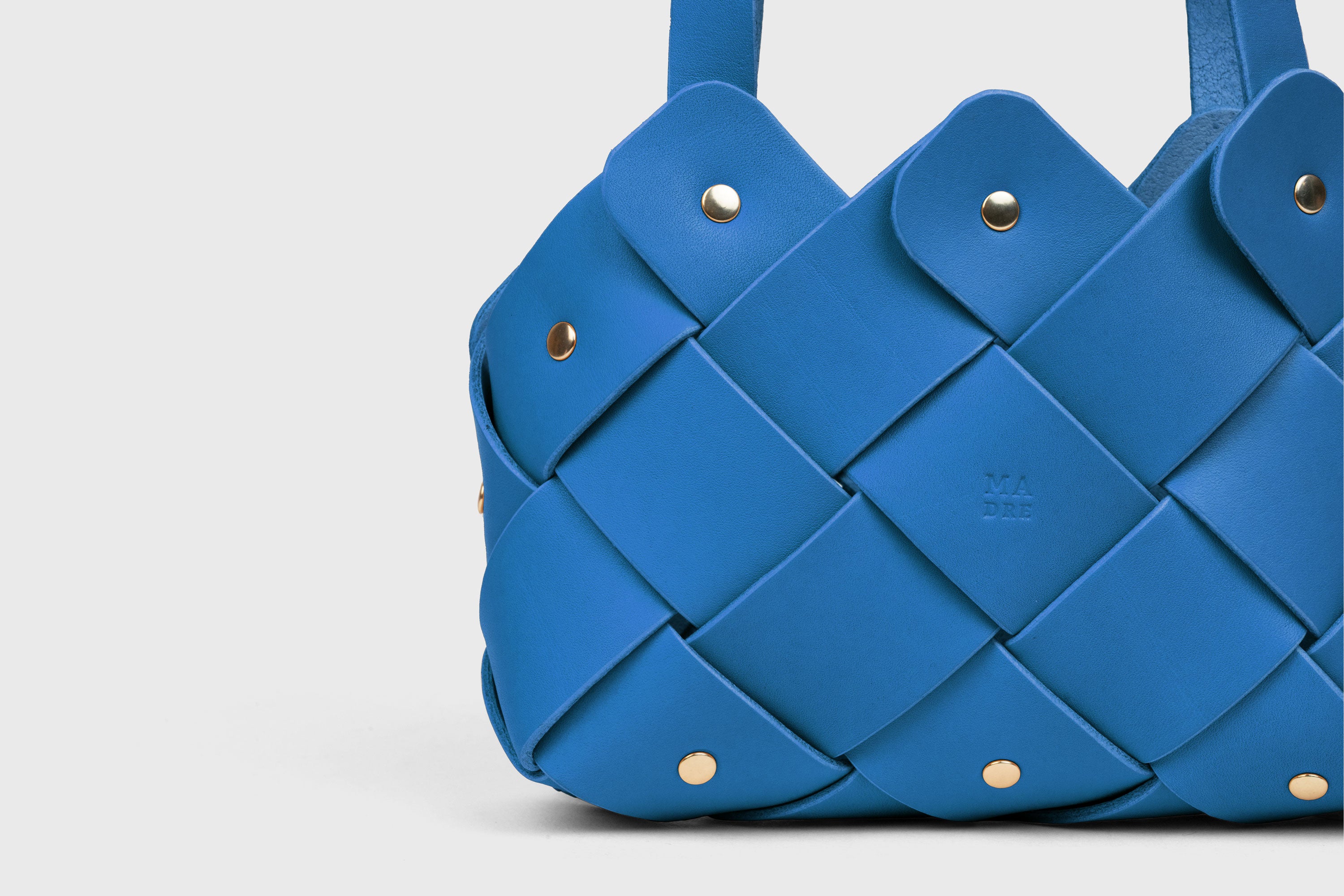 Pine Mini Tote Bag In Royal Blue Color In Vegetable Tanned Leather Woven Technique and Brass Rivets Atelier Madre Manuel Dreesmann Barcelona Spain