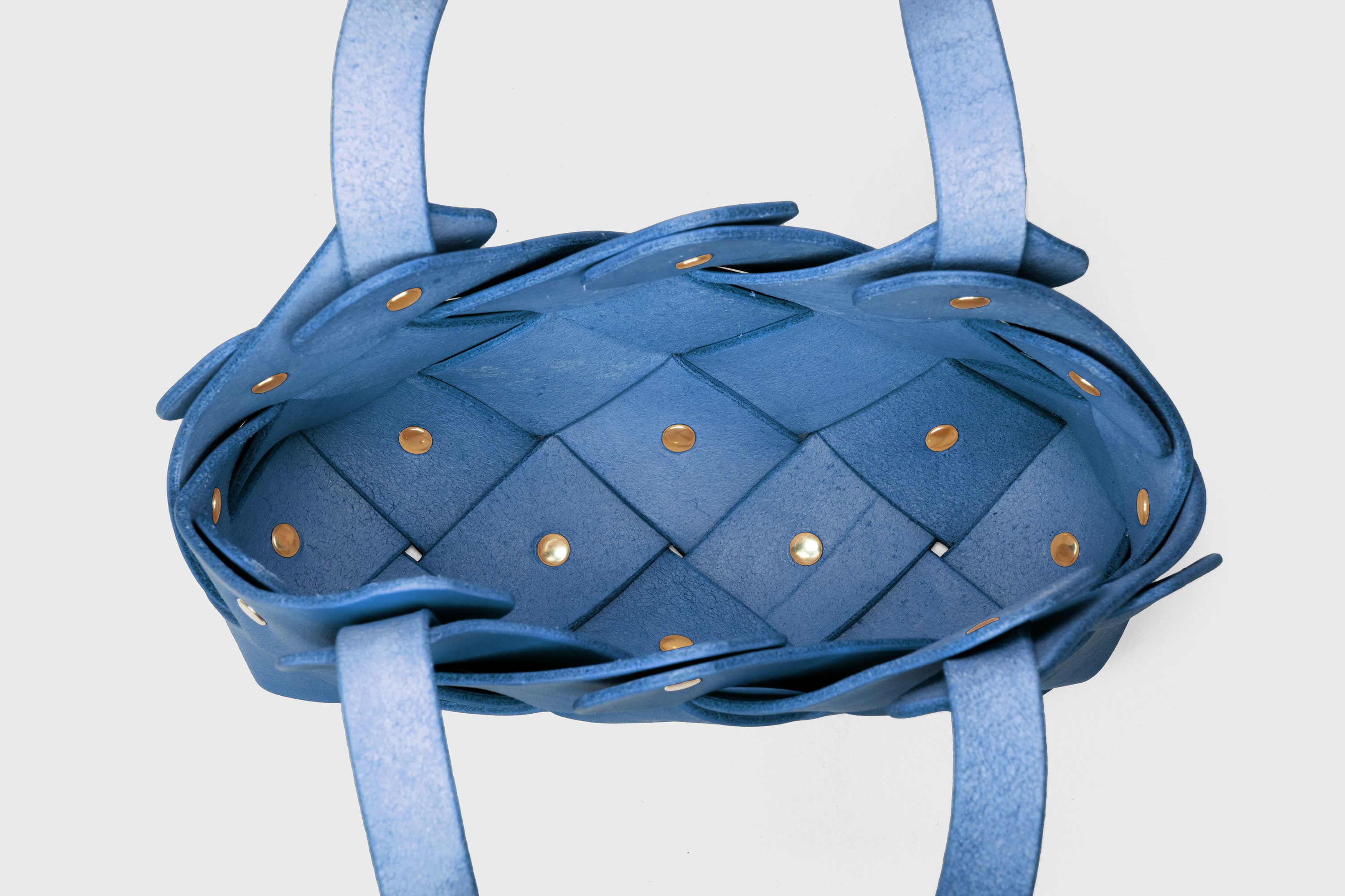 Pine Mini Tote Bag In Royal Blue Color In Vegetable Tanned Leather Woven Technique and Brass Rivets Atelier Madre Manuel Dreesmann Barcelona Spain