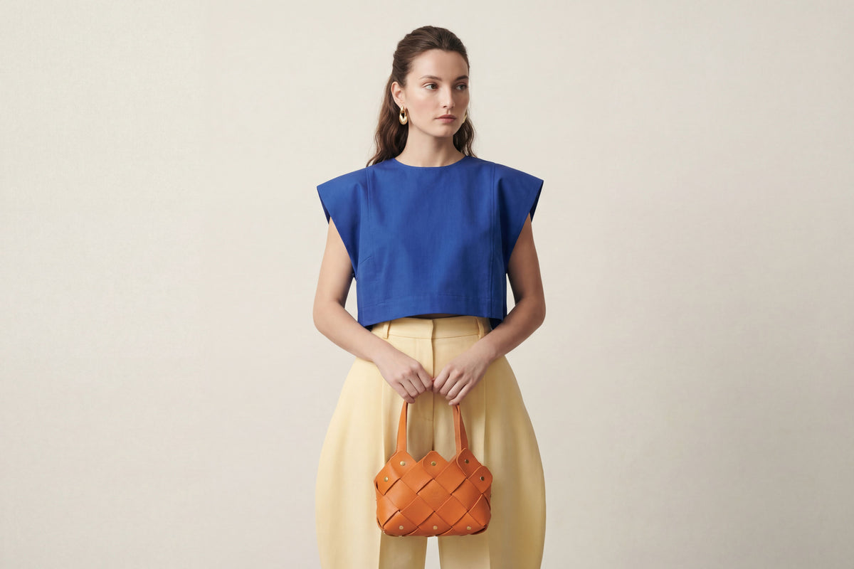 Pine Mini Tote Bag on a model Orange Colour Leather Vegetable Tanned Modern Minimal Design Premium Quality Atelier Madre Manuel Dreesmann Barcelona 2