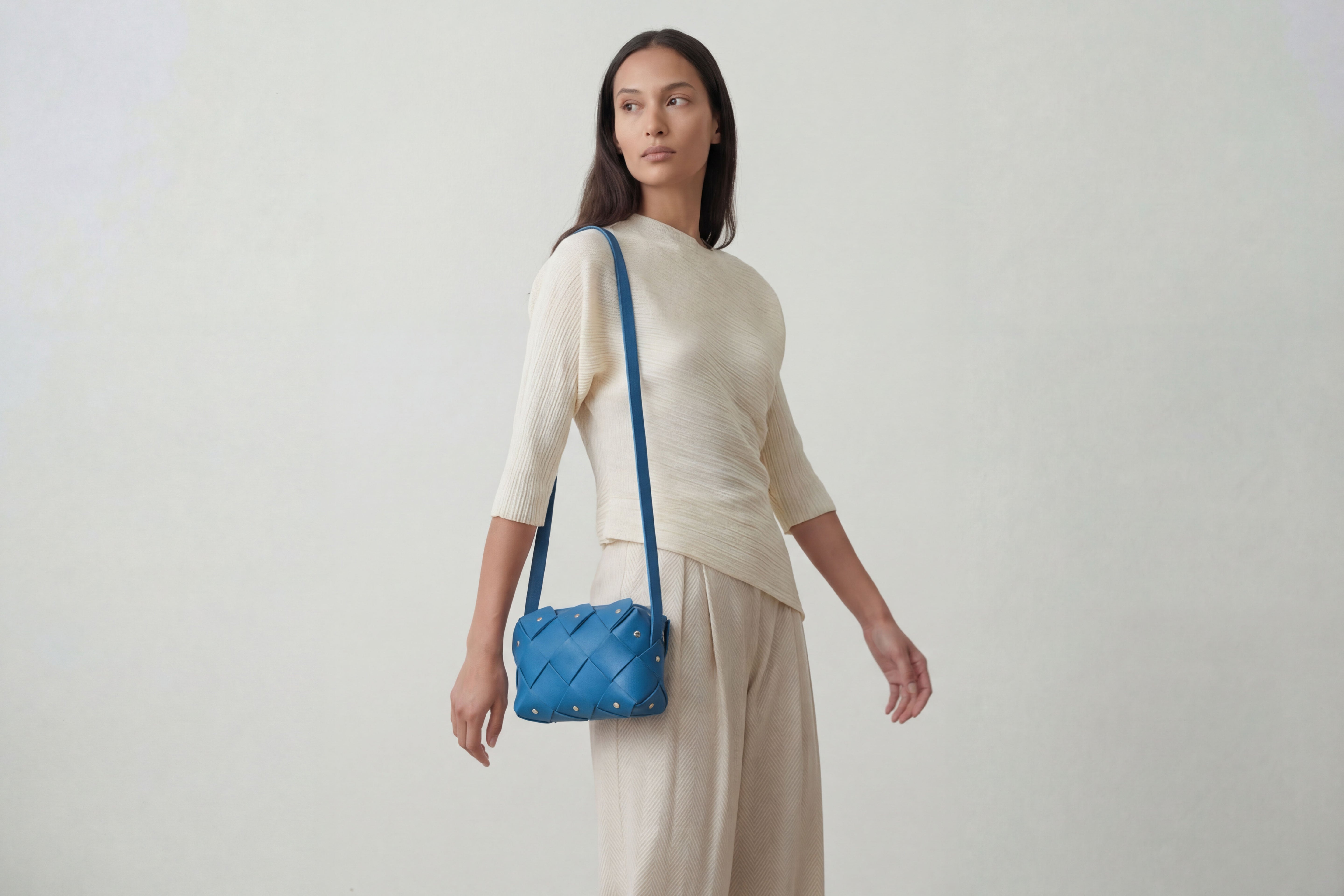 Pine Mini Zipper Bag In Royal Blue Colour In Vegetable Tanned Leather On A Model Woven Structure Unique Design Atelier Madre Manuel Dreesmann Barcelona Spain