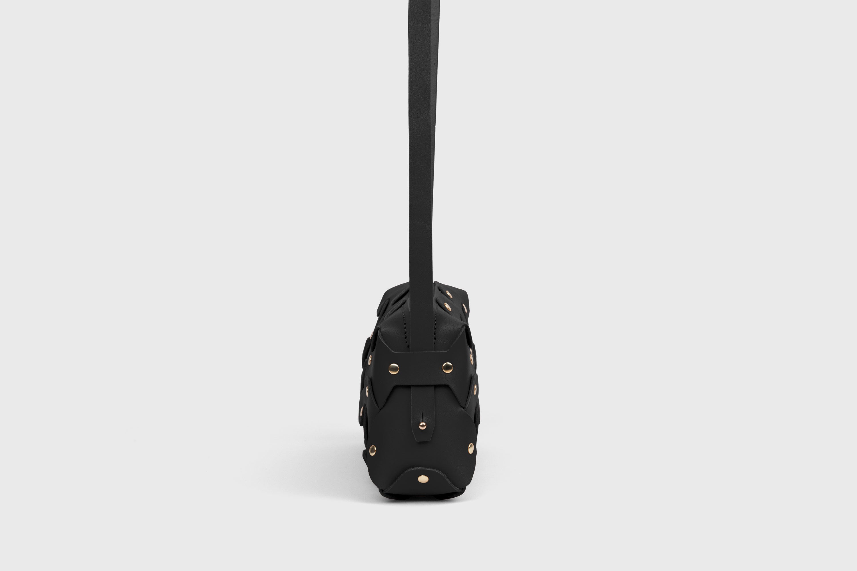 Rivet Bag 01 In Black Color In Vegetable Tanned Leather With Brass Rivets Unique Design Atelier Madre Manuel Dreesmann Barcelona Spain