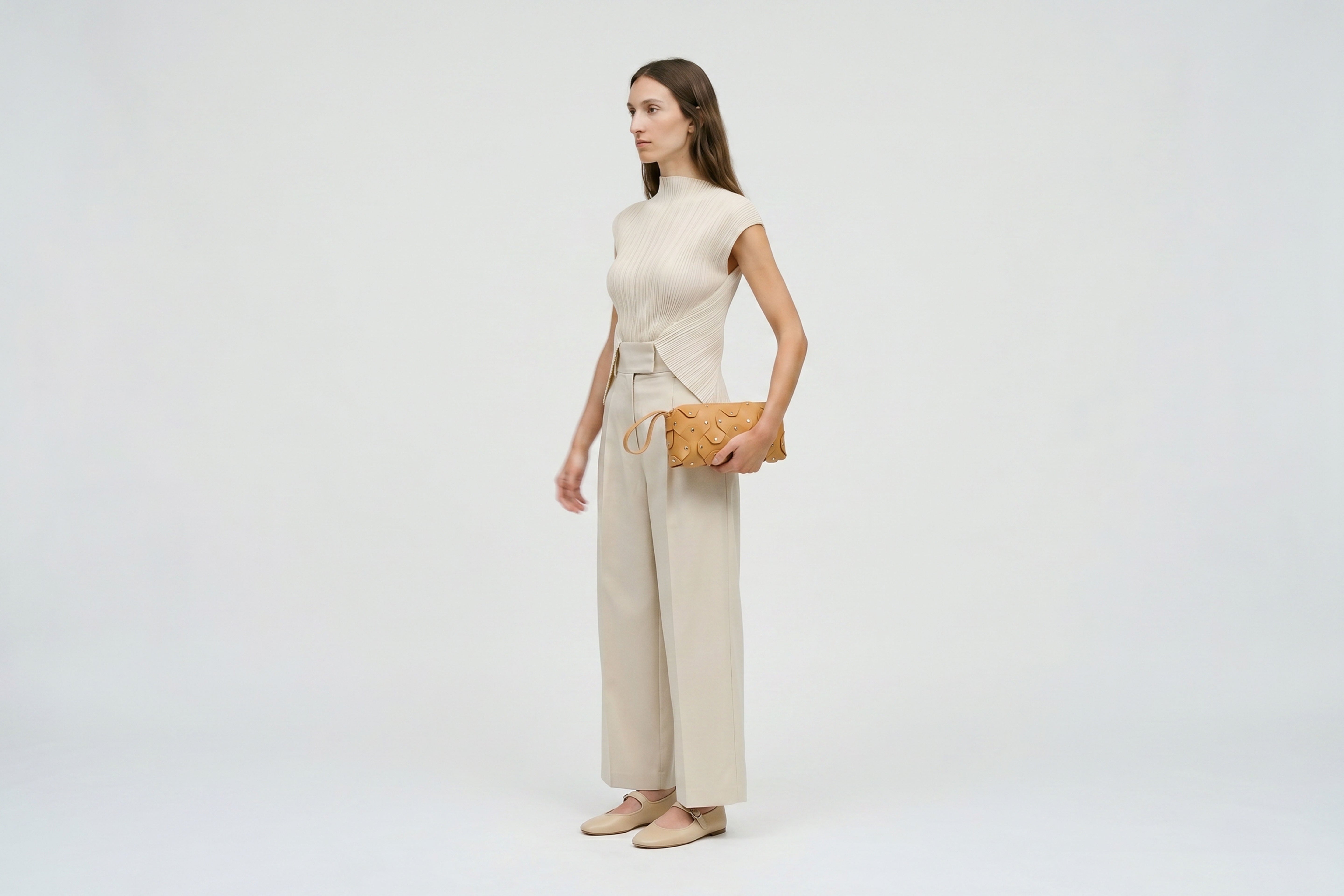 Rivet Bag 01 In Brown Color On A Woman Model In Vegetable Tanned Leather With Brass Rivets Unique Design Atelier Madre Manuel Dreesmann Barcelona Spain