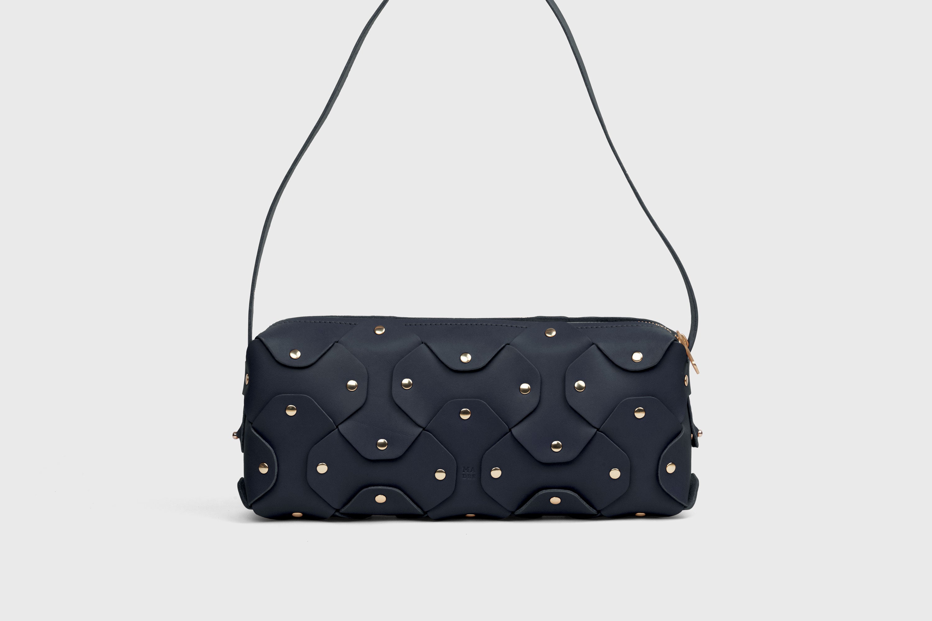 Rivet Bag 01 In Marine Blue Color In Vegetable Tanned Leather With Brass Rivets Unique Design Atelier Madre Manuel Dreesmann Barcelona Spain