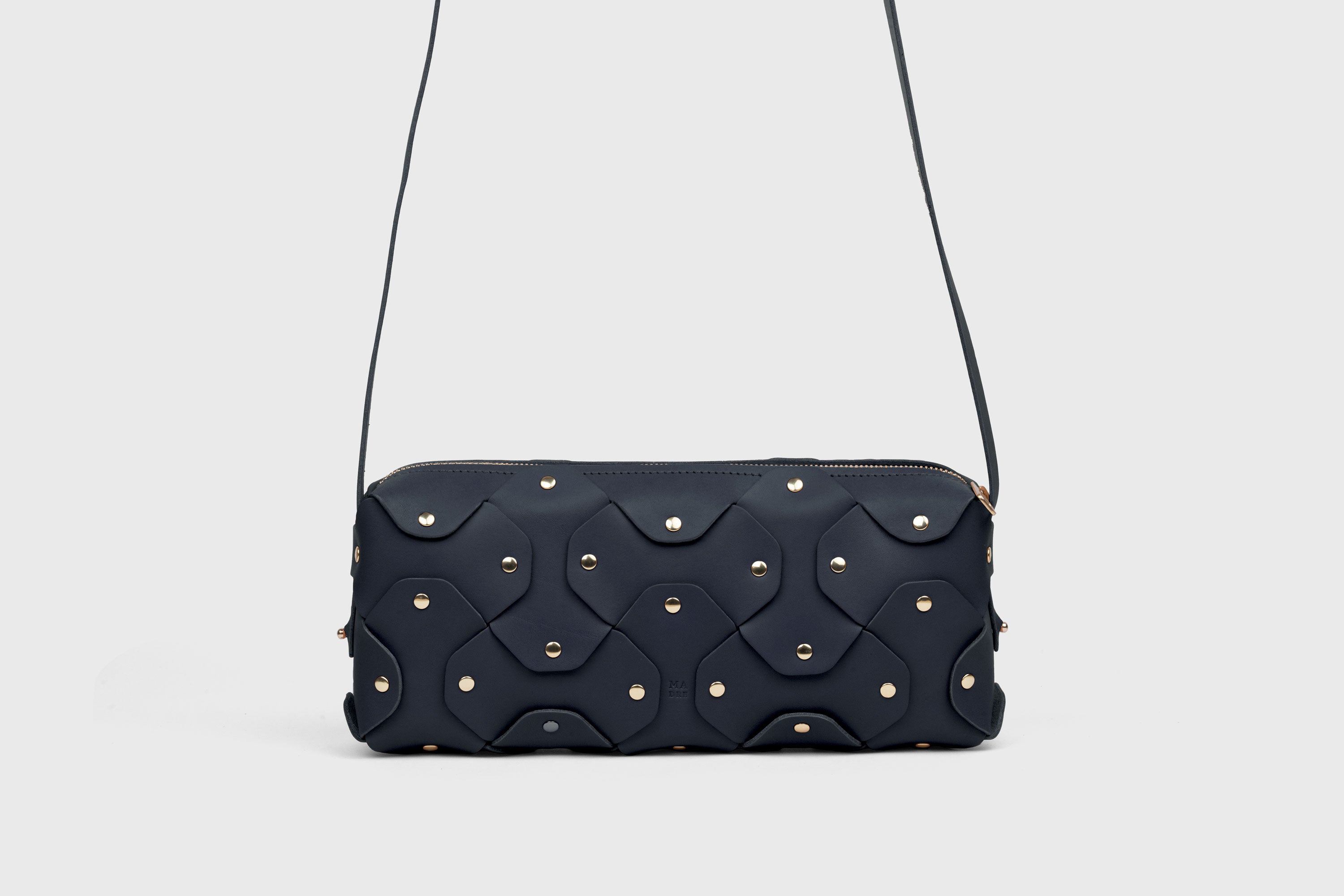 Rivet Bag 01 In Marine Blue Color In Vegetable Tanned Leather With Brass Rivets Unique Design Atelier Madre Manuel Dreesmann Barcelona Spain