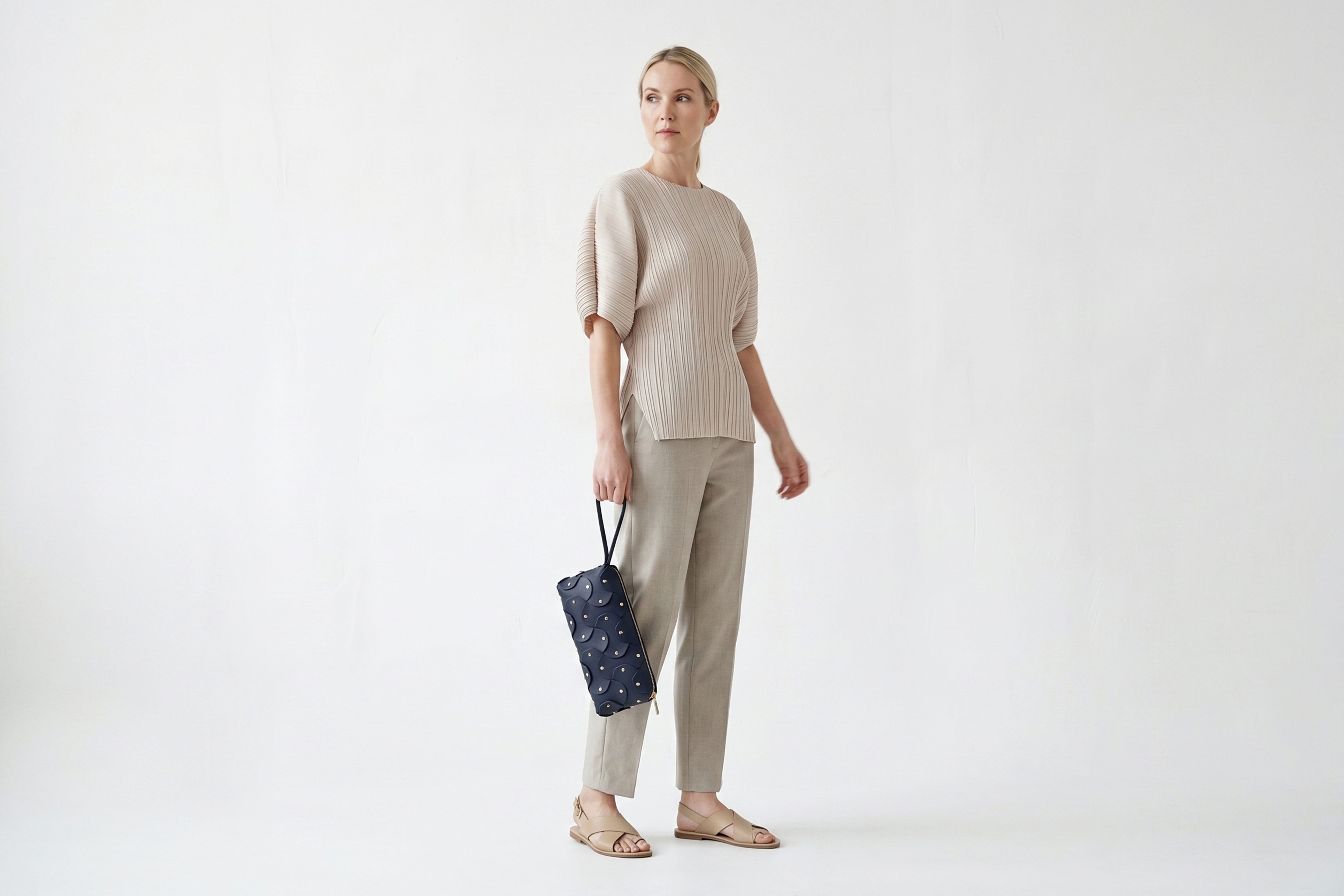 Rivet Bag 01 In Marine Blue Color On A Woman Model In Vegetable Tanned Leather With Brass Rivets Unique Design Atelier Madre Manuel Dreesmann Barcelona Spain