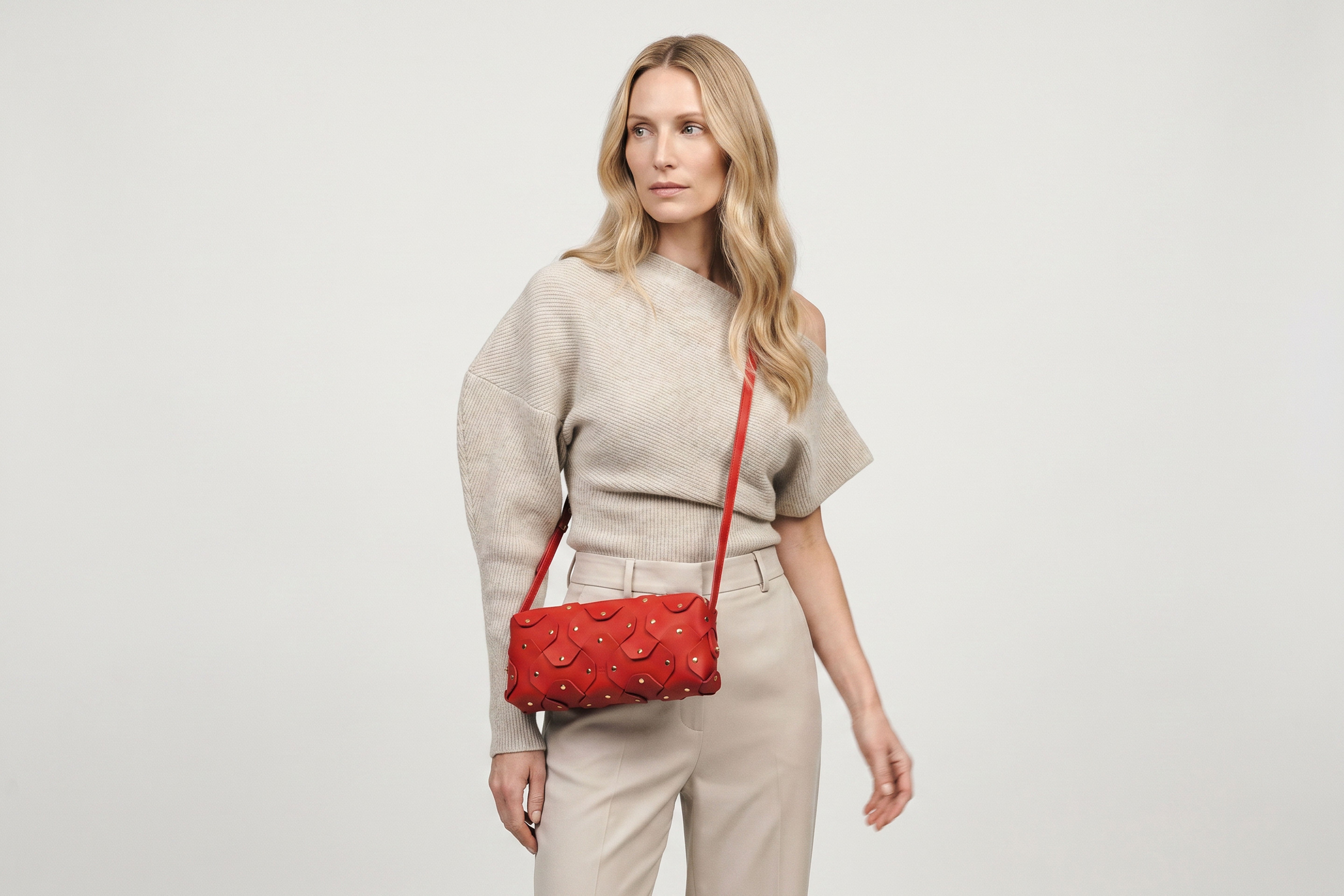 Rivet Bag 01 In Red Color On A Woman Model In Vegetable Tanned Leather With Brass Rivets Unique Design Atelier Madre Manuel Dreesmann Barcelona Spain