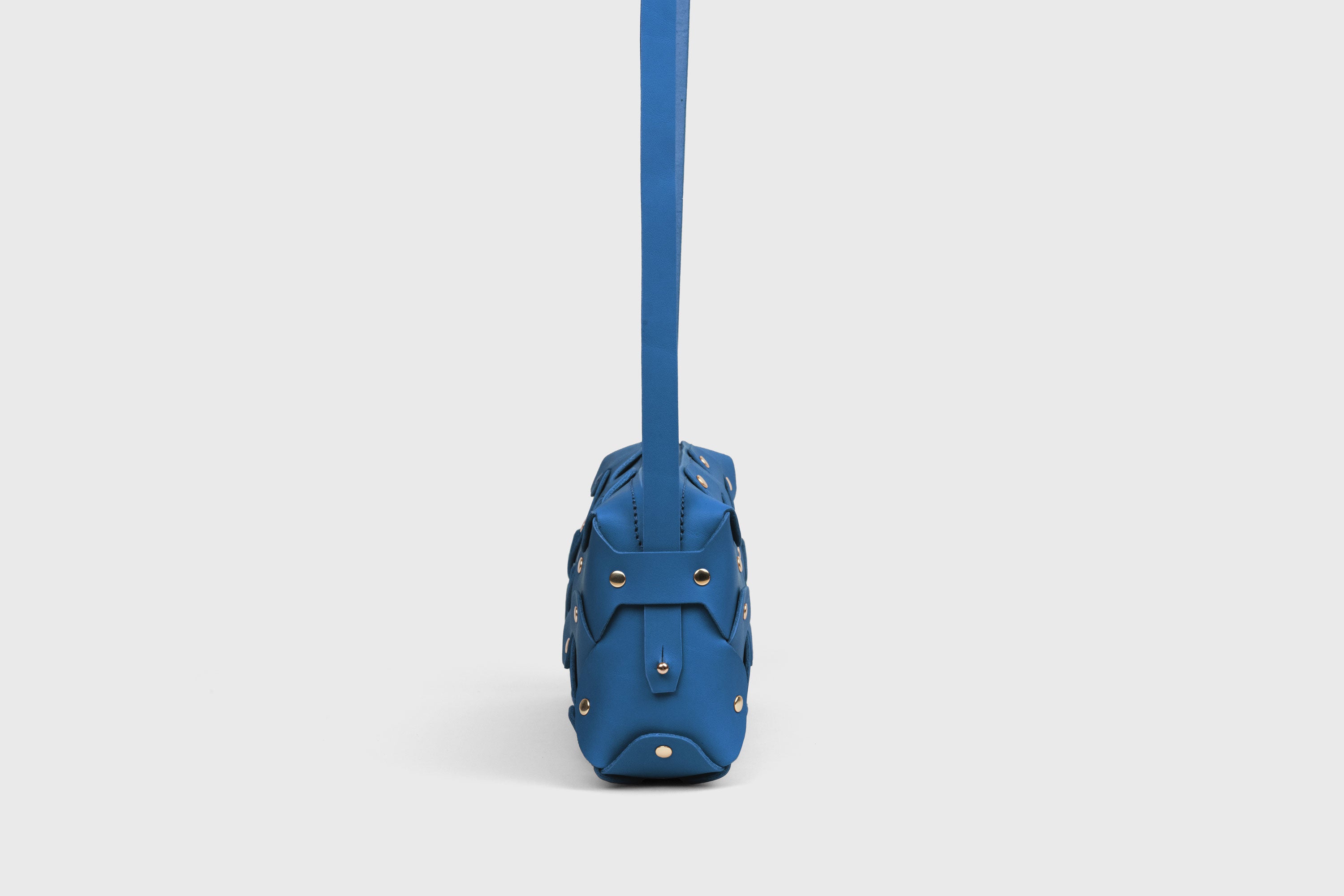 Rivet Bag 01 In Royal Blue Color In Vegetable Tanned Leather With Brass Rivets Unique Design Atelier Madre Manuel Dreesmann Barcelona Spain
