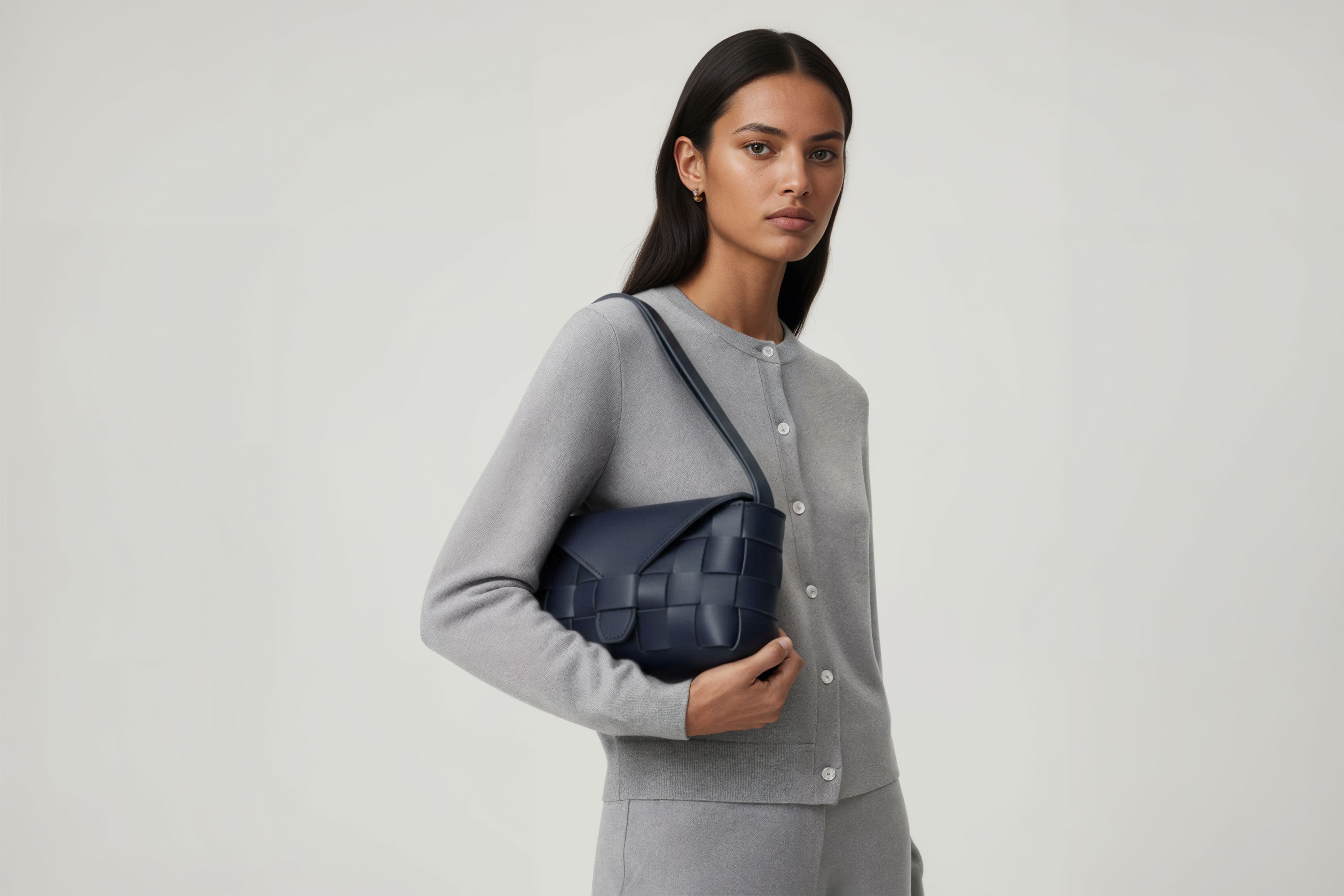 Leather Bag Marine Blue Color Big Saka On A Woman Model Braided  Vegetable Tanned Leather Modern Minimalist Design Premium Quality Atelier Madre Manuel Dreesmann Barcelona Spain