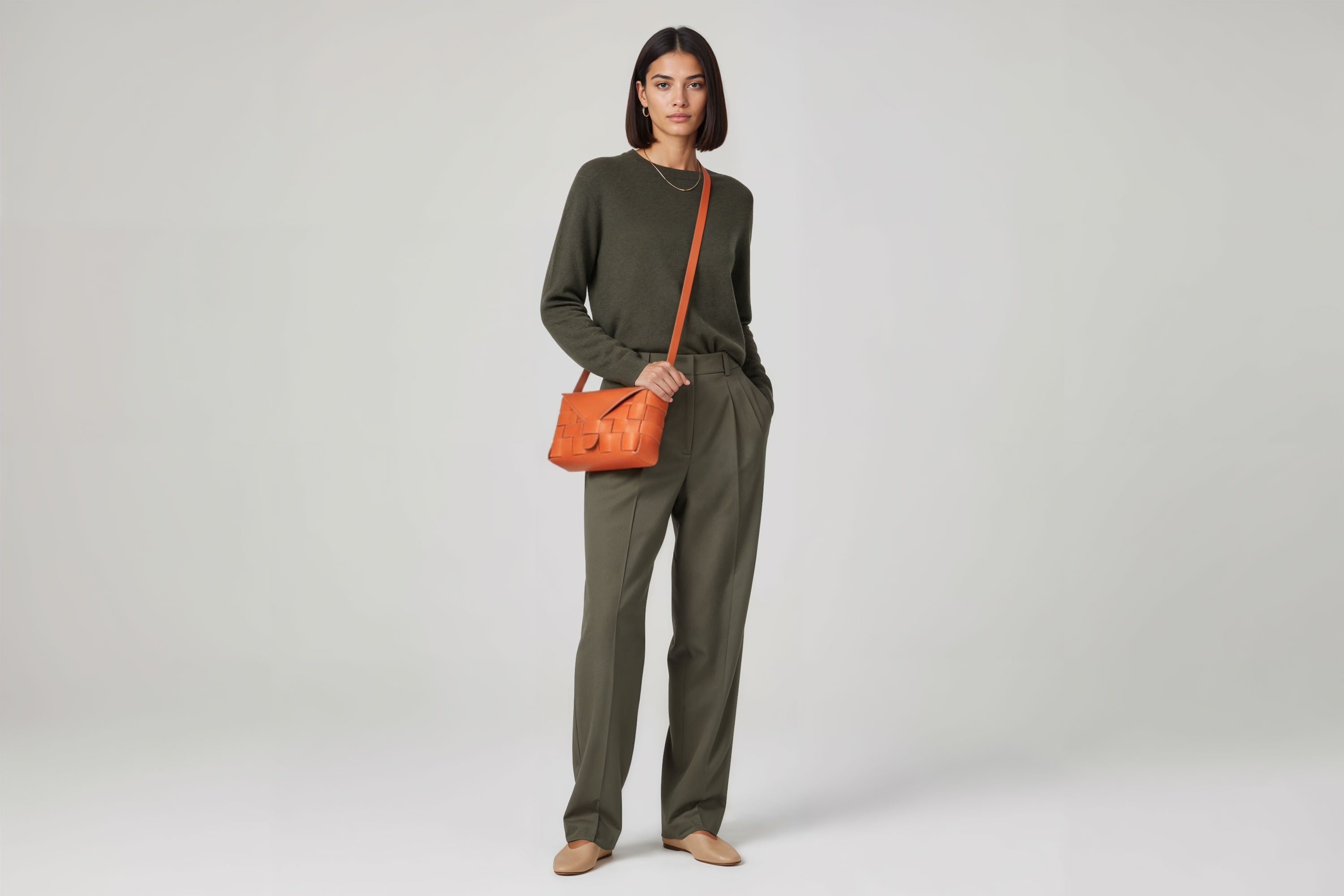 Leather Bag Orange Color Big Saka On A Woman Model Braided  Vegetable Tanned Leather Modern Minimalist Design Premium Quality Atelier Madre Manuel Dreesmann Barcelona Spain