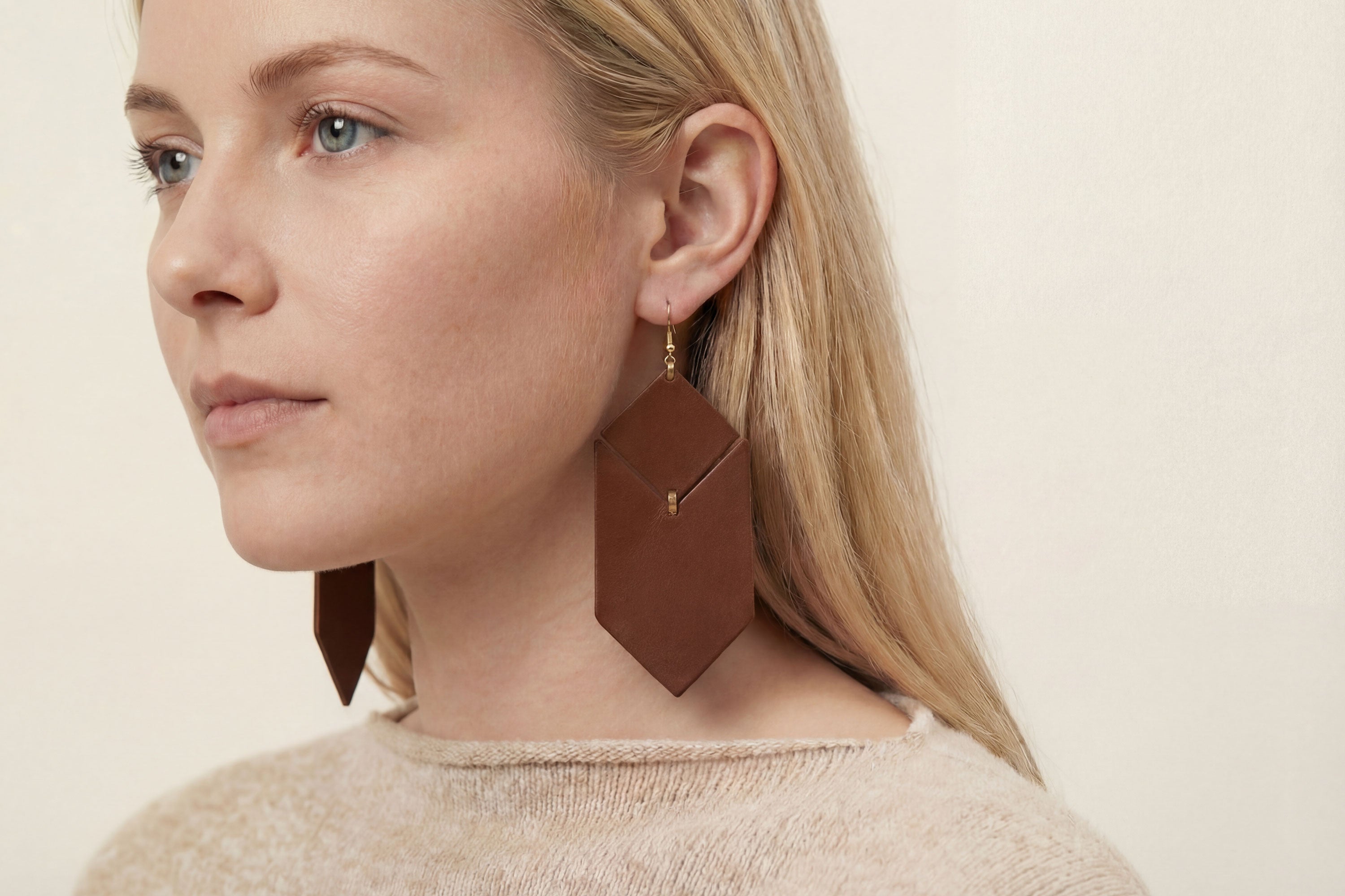 Tess Earrings Leather In Dark Brown Color On Model Vegetable Tanned Leather Minimalistic Design Atelier Madre Manuel Dreesmann Barcelona Spain