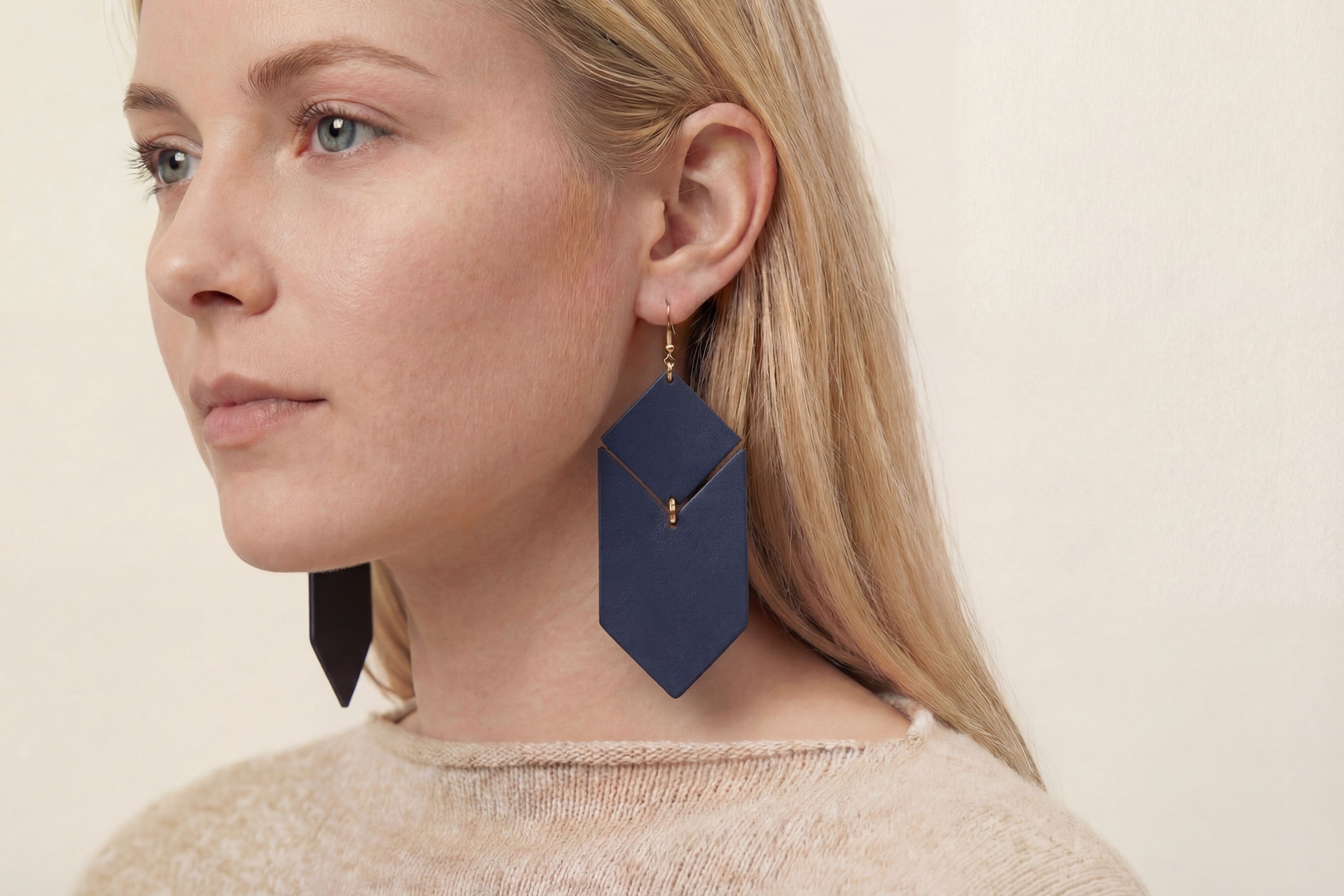 Tess Earrings Leather In Marine Blue Color On Model Vegetable Tanned Leather Minimalistic Design Atelier Madre Manuel Dreesmann Barcelona Spain