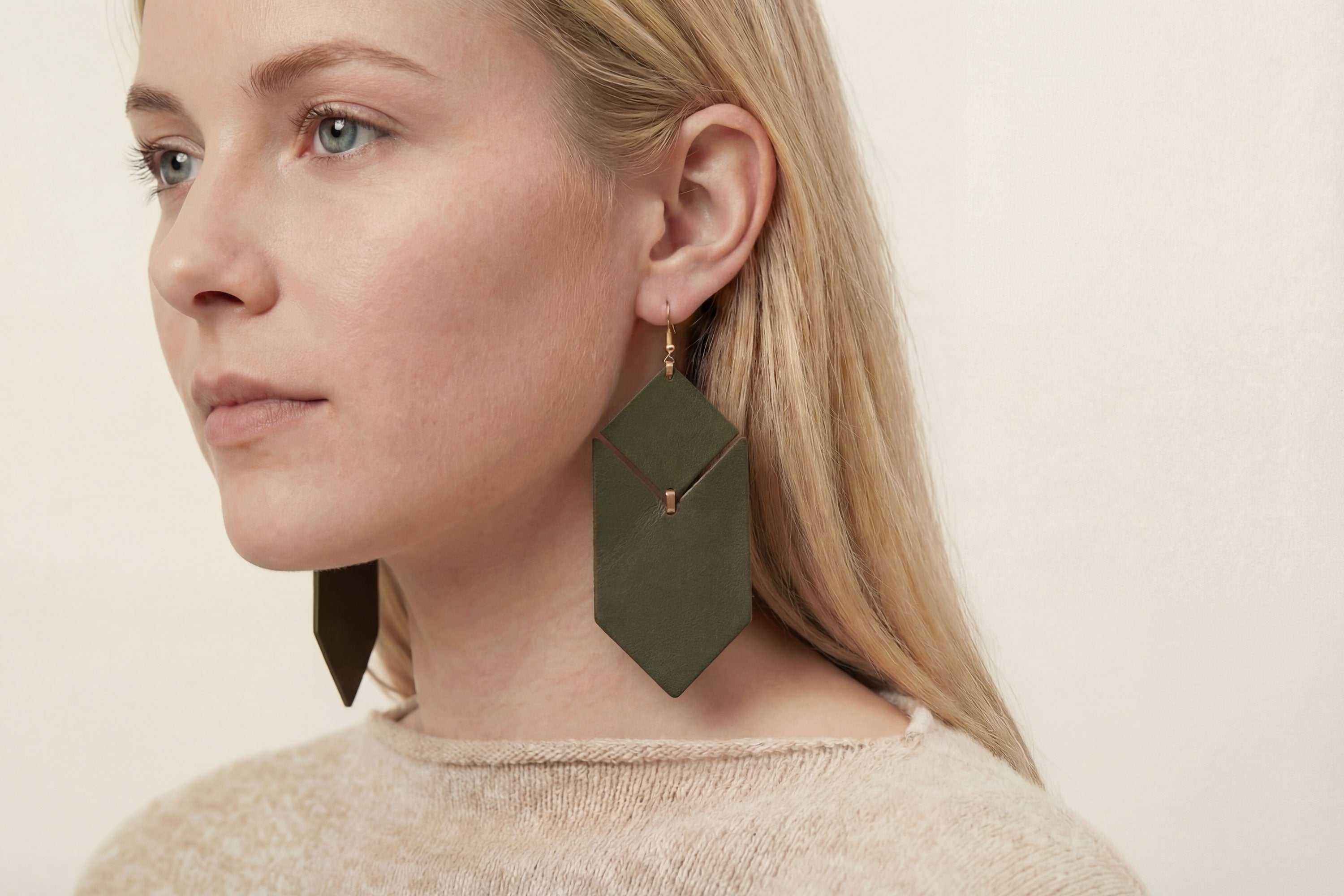 Tess Earrings Leather In Olive Green Color On Model Vegetable Tanned Leather Minimalistic Design Atelier Madre Manuel Dreesmann Barcelona Spain