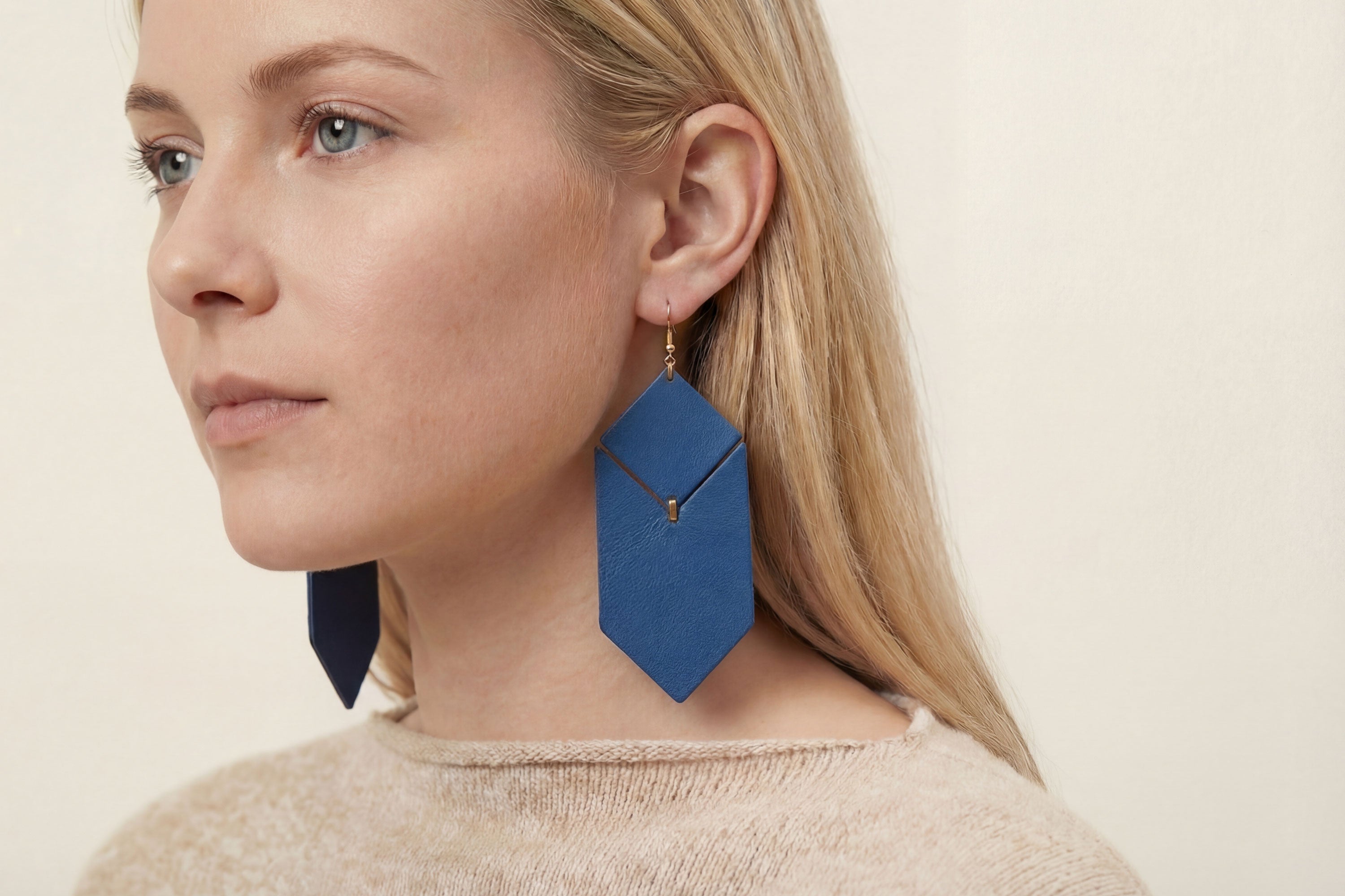 Tess Earrings Leather In Royal Blue Color On Model Vegetable Tanned Leather Minimalistic Design Atelier Madre Manuel Dreesmann Barcelona Spain