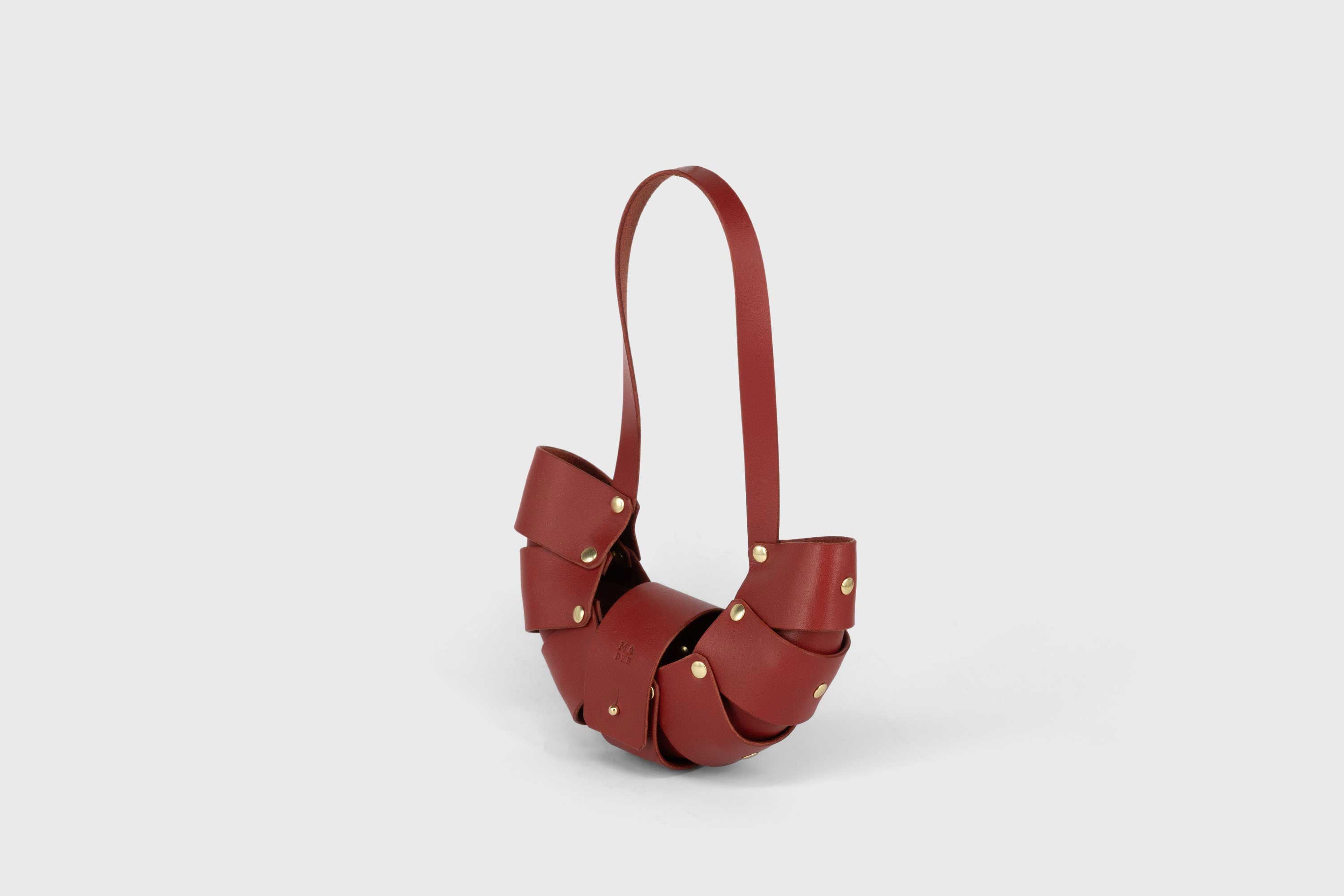 Croissant MIni Bag Leather Red Vegetable Tanned Full Grain Spain Brass Rivets Design Minimalist Modern Small Tiny Miniature Bag Pouch Handbag Handmade Atelier Madre Manuel Dreesmann Barcelona