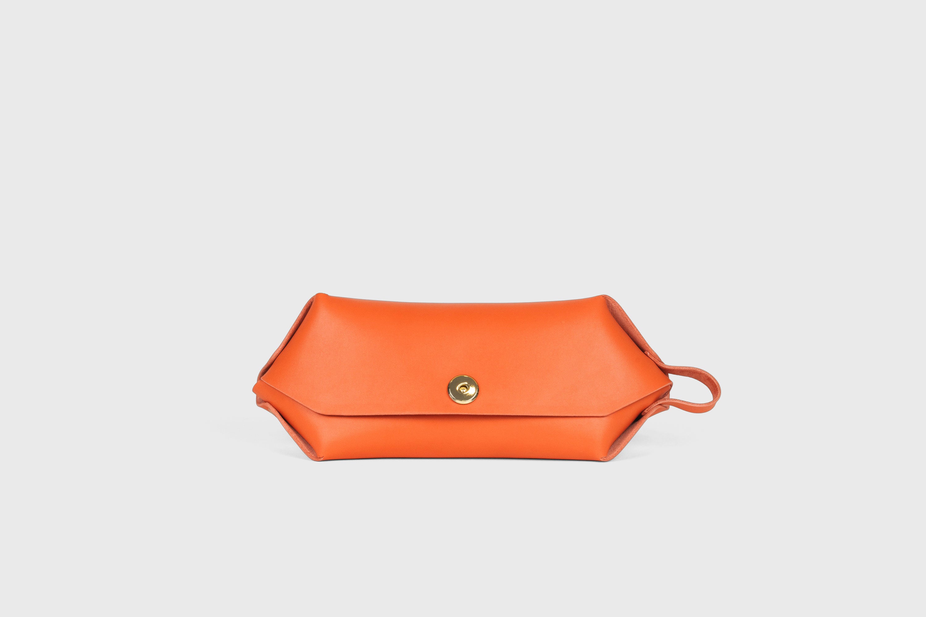 Cosmetic and Toiletry Bag Orange Color Leather Dopp Kit Mens Woman's Pouch Makeup Case Minimalistic Modern Design Atelier Madre Manuel Dreesmann Barcelona Spain