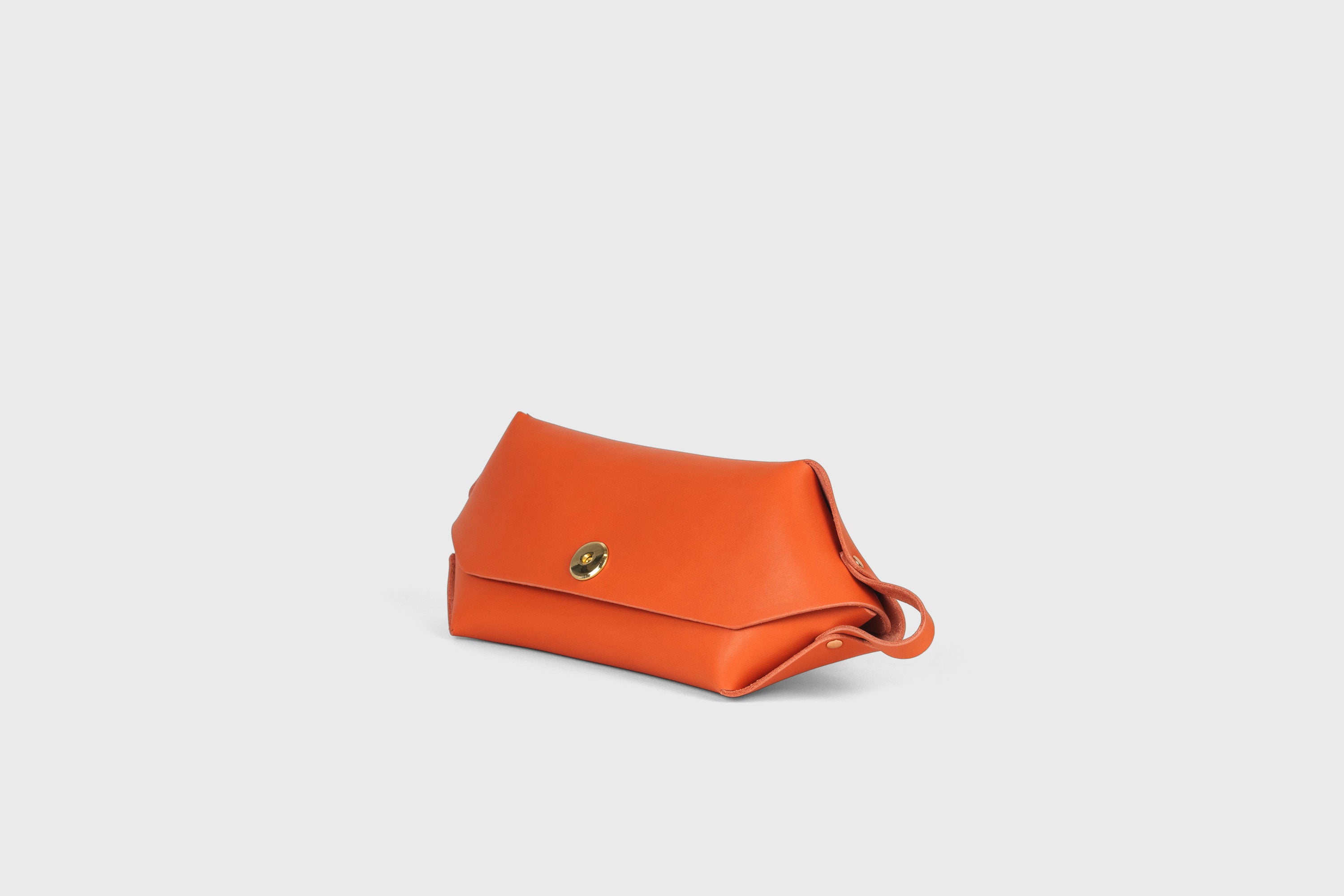 Cosmetic and Toiletry Bag Orange Color Leather Dopp Kit Mens Woman's Pouch Makeup Case Minimalistic Modern Design Atelier Madre Manuel Dreesmann Barcelona Spain