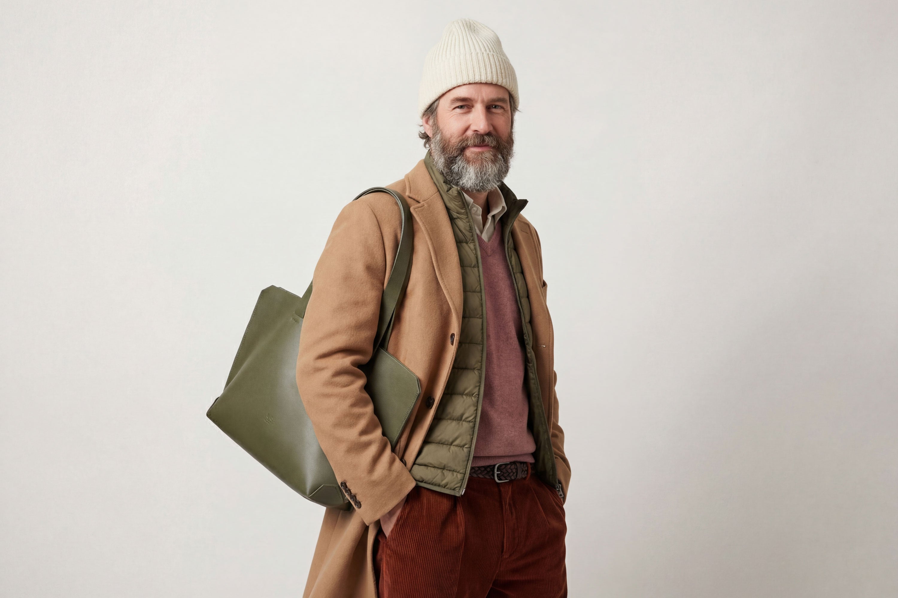 Tote Bag Leather Olive Green Color On A Man Model Vegetable Tanned Leather Natural Minimalistic Design By Manuel Dreesmann Atelier Madre Barcelona Spain