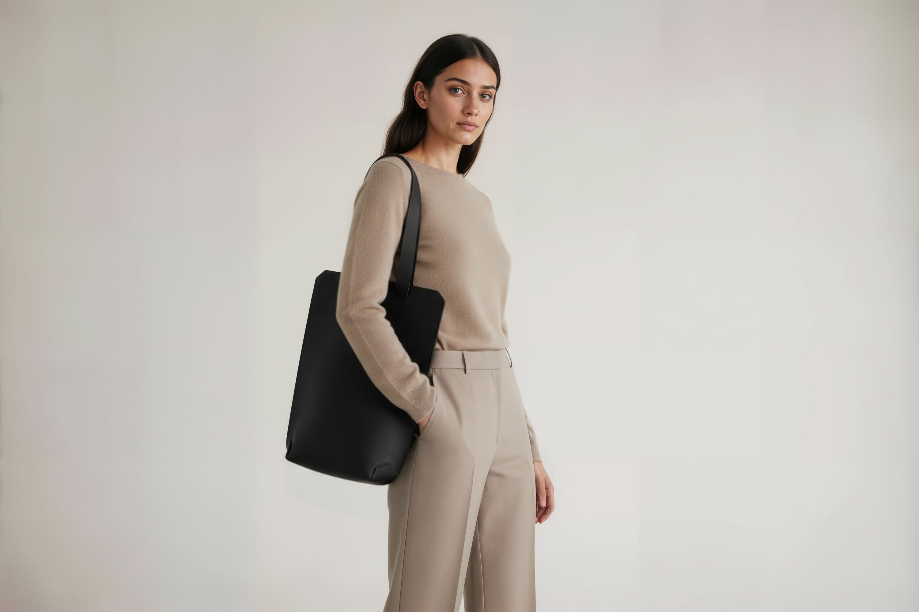 Tote Bag Long Black Color Leather Bag On A Woman Model Vegetable Tanned Leather Exclusive Quality Craftsmanship Handmade Design By Manuel Dreesmann Atelier Madre Barcelona Spain