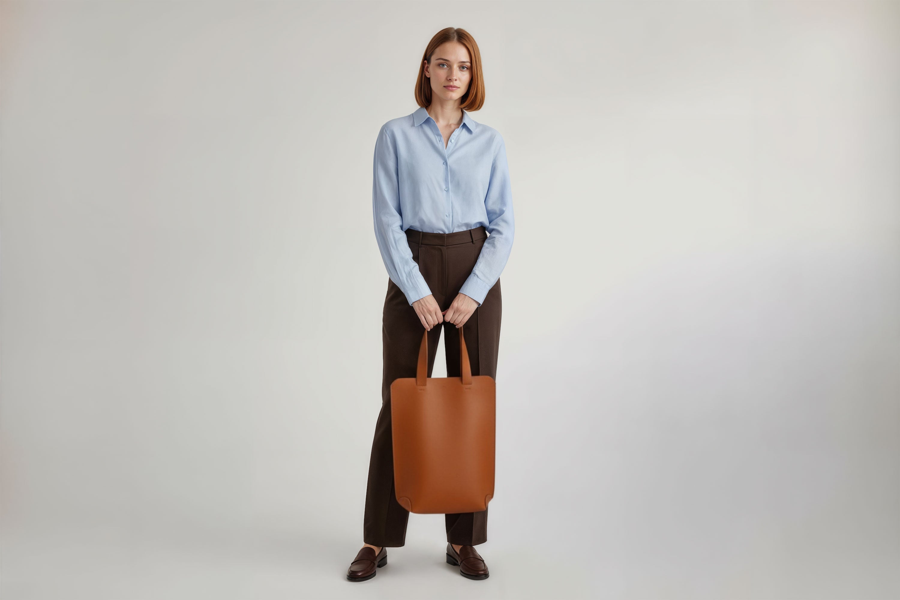 Tote Bag Long Dark Brown Color Leather Bag On A Woman Model Vegetable Tanned Leather Exclusive Quality Craftsmanship Handmade Design By Manuel Dreesmann Atelier Madre Barcelona Spain