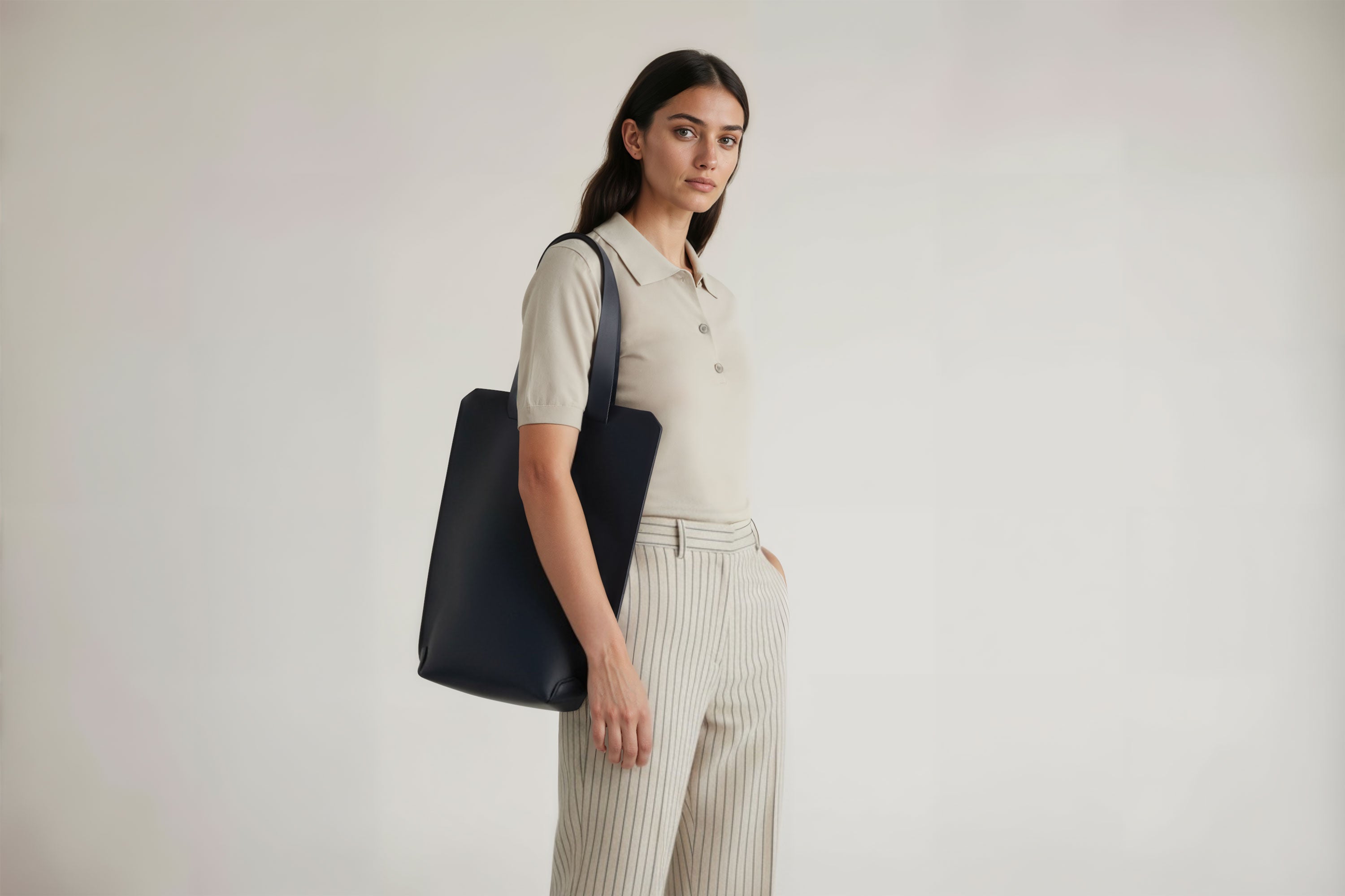 Tote Bag Long Marine Blue Color Leather Bag On A Woman Model Vegetable Tanned Leather Exclusive Quality Craftsmanship Handmade Design By Manuel Dreesmann Atelier Madre Barcelona Spain