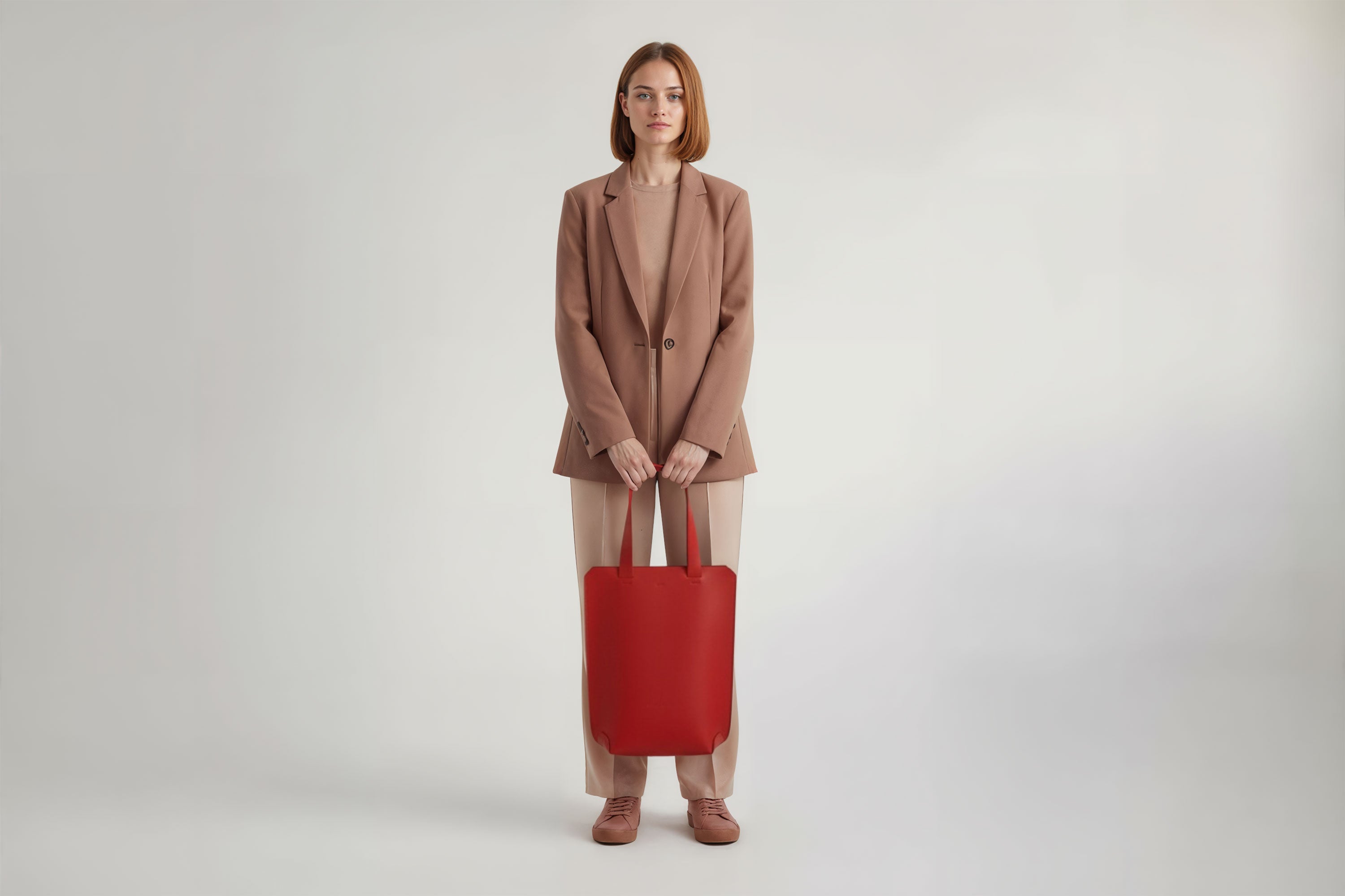 Tote Bag Long Red Color Leather Bag On A Woman Model Vegetable Tanned Leather Exclusive Quality Craftsmanship Handmade Design By Manuel Dreesmann Atelier Madre Barcelona Spain