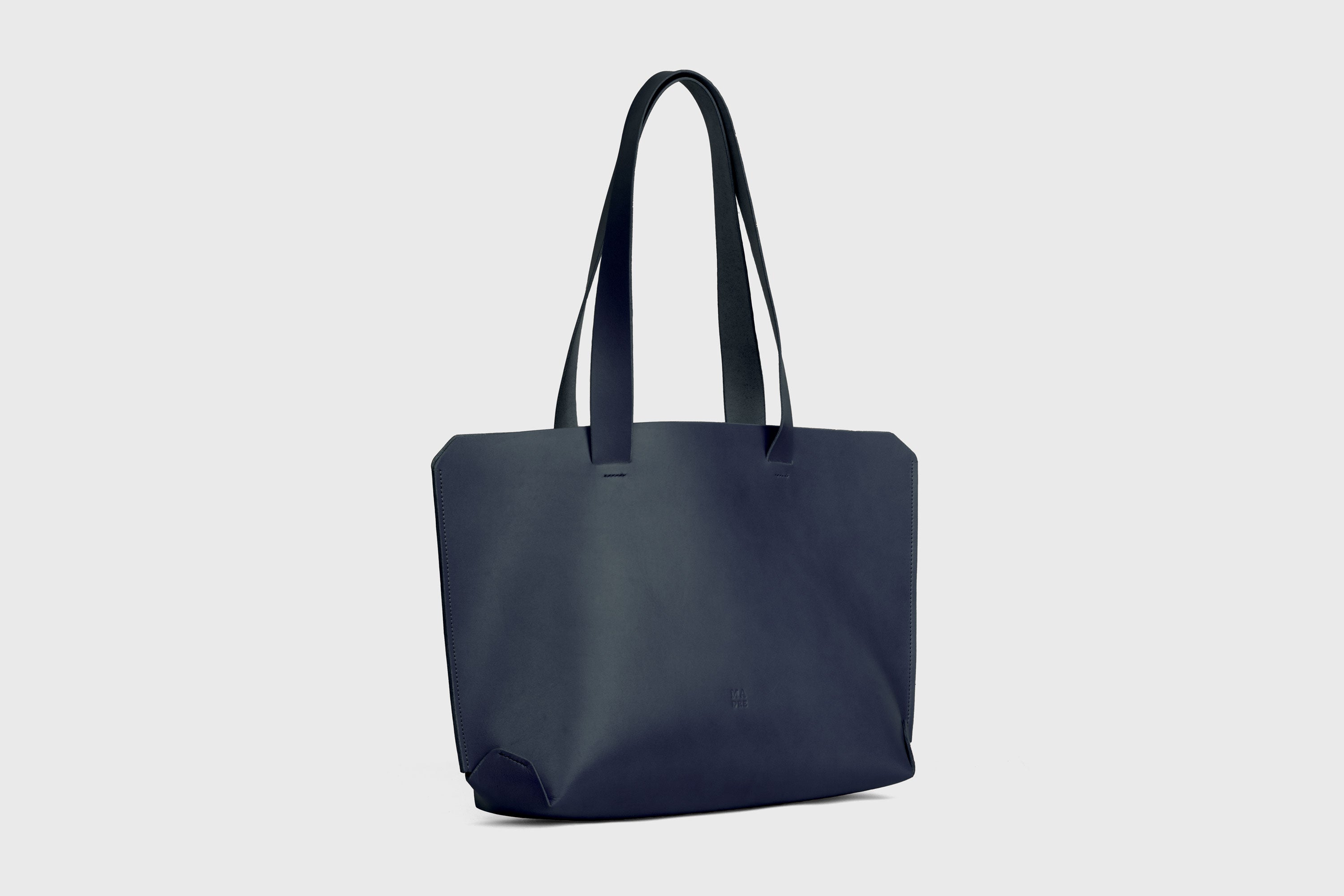 Tote H Bag In Marine Blue Color In Vegetable Tanned Leather Minimalistic Design Open Top Atelier Madre Manuel Dreesmann Barcelona Spain