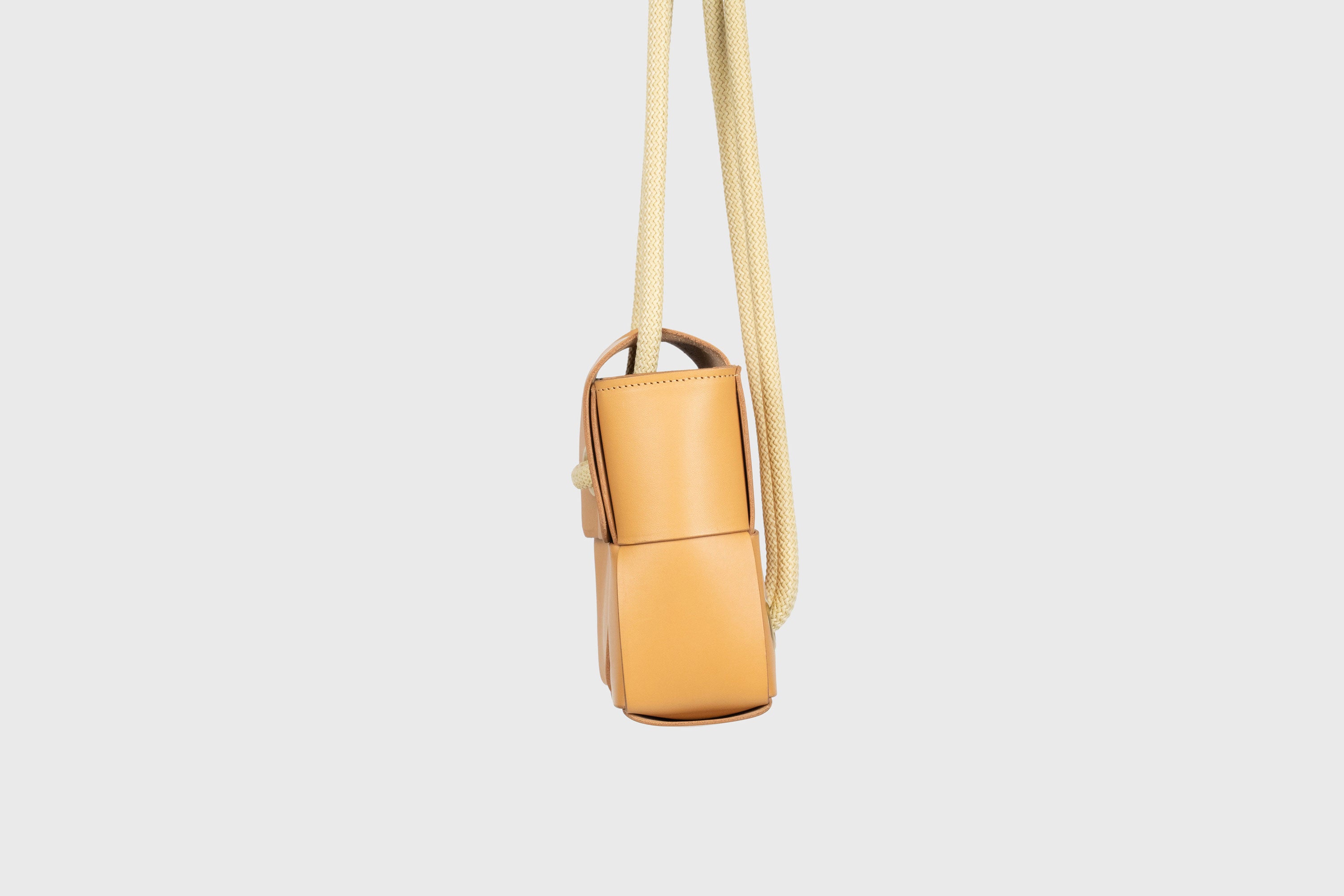Elegant Atelier Madre Brown Color woven leather backpack, designed by Manuel Dreesmann, showcasing exquisite craftsmanship and luxury style, crafted in the heart of Barcelona.