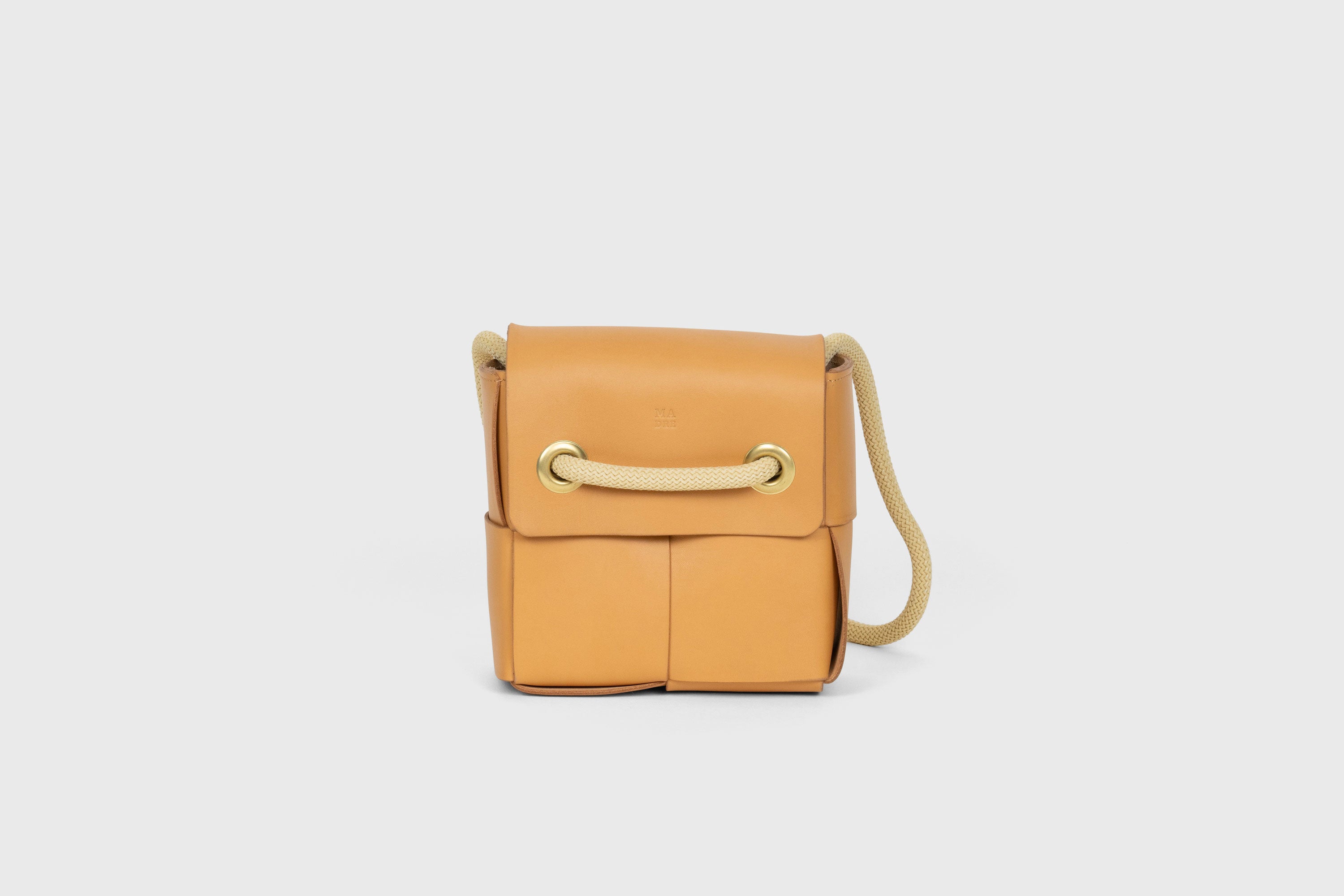 Elegant Atelier Madre Brown Color woven leather backpack, designed by Manuel Dreesmann, showcasing exquisite craftsmanship and luxury style, crafted in the heart of Barcelona.