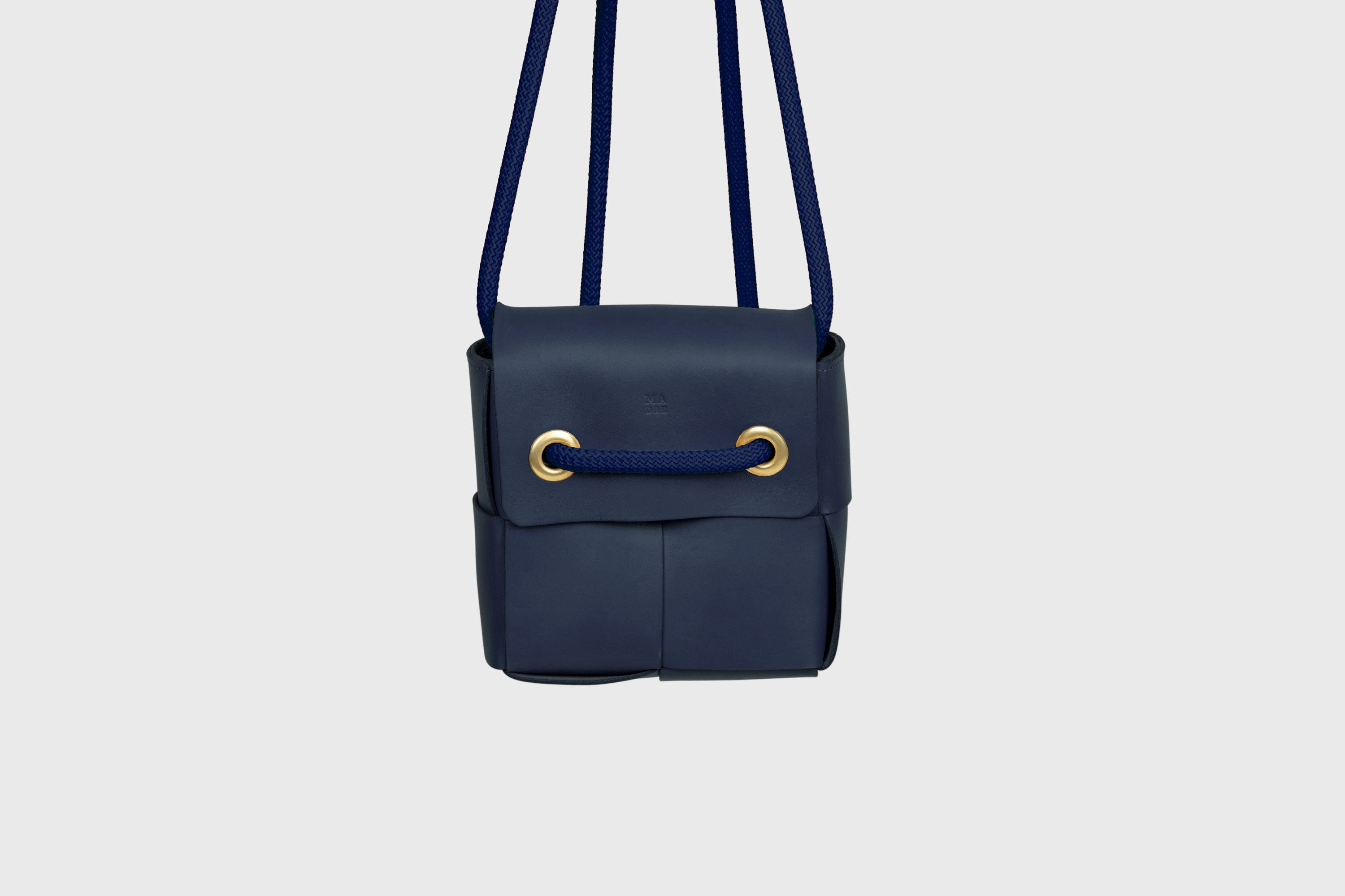 Elegant Atelier Madre Marine Blue Color woven leather backpack, designed by Manuel Dreesmann, showcasing exquisite craftsmanship and luxury style, crafted in the heart of Barcelona.
