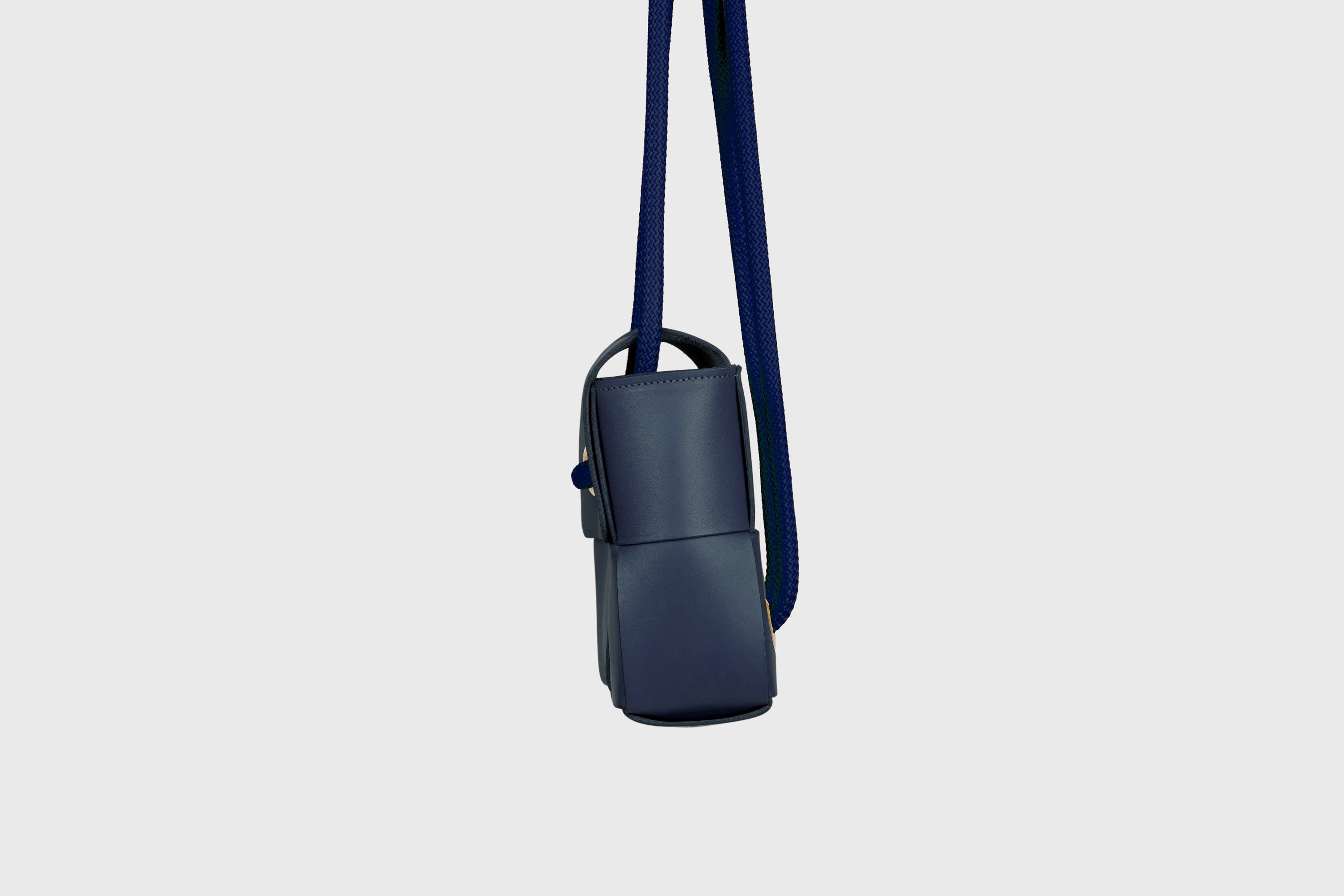 Elegant Atelier Madre Marine Blue Color woven leather backpack, designed by Manuel Dreesmann, showcasing exquisite craftsmanship and luxury style, crafted in the heart of Barcelona.