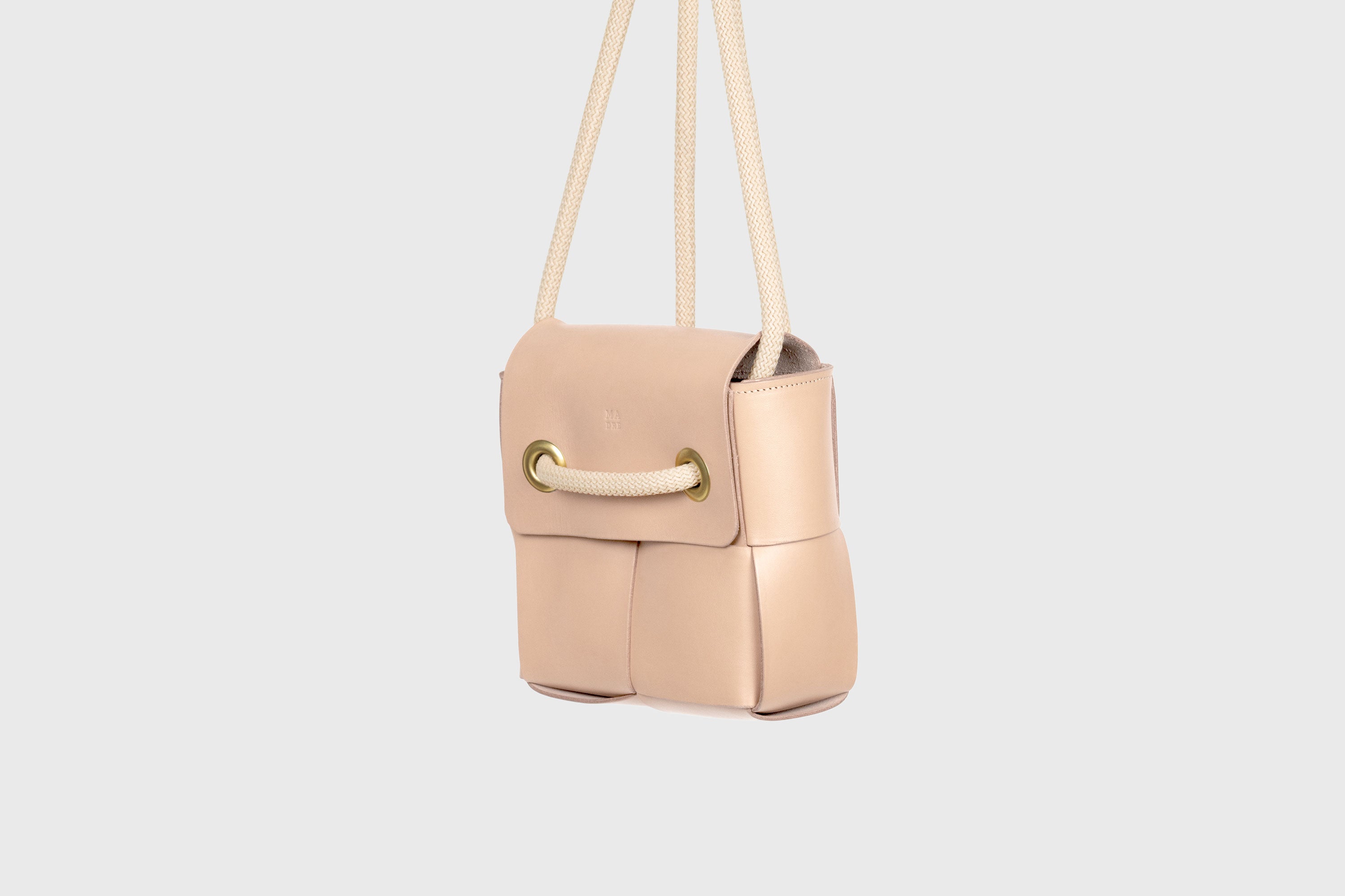 Elegant Atelier Madre Natural Color woven leather backpack, designed by Manuel Dreesmann, showcasing exquisite craftsmanship and luxury style, crafted in the heart of Barcelona.