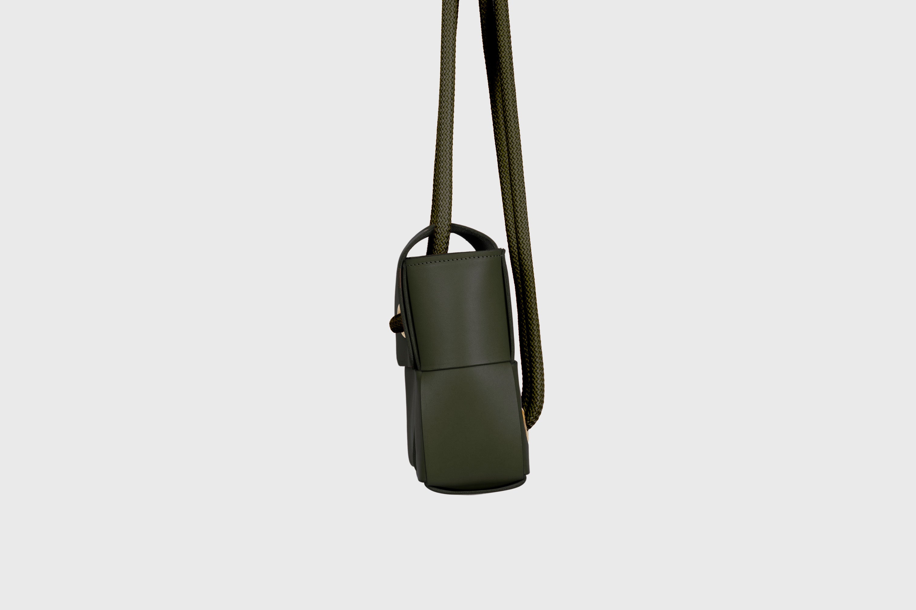 Elegant Atelier Madre Olive Green Color woven leather backpack, designed by Manuel Dreesmann, showcasing exquisite craftsmanship and luxury style, crafted in the heart of Barcelona.
