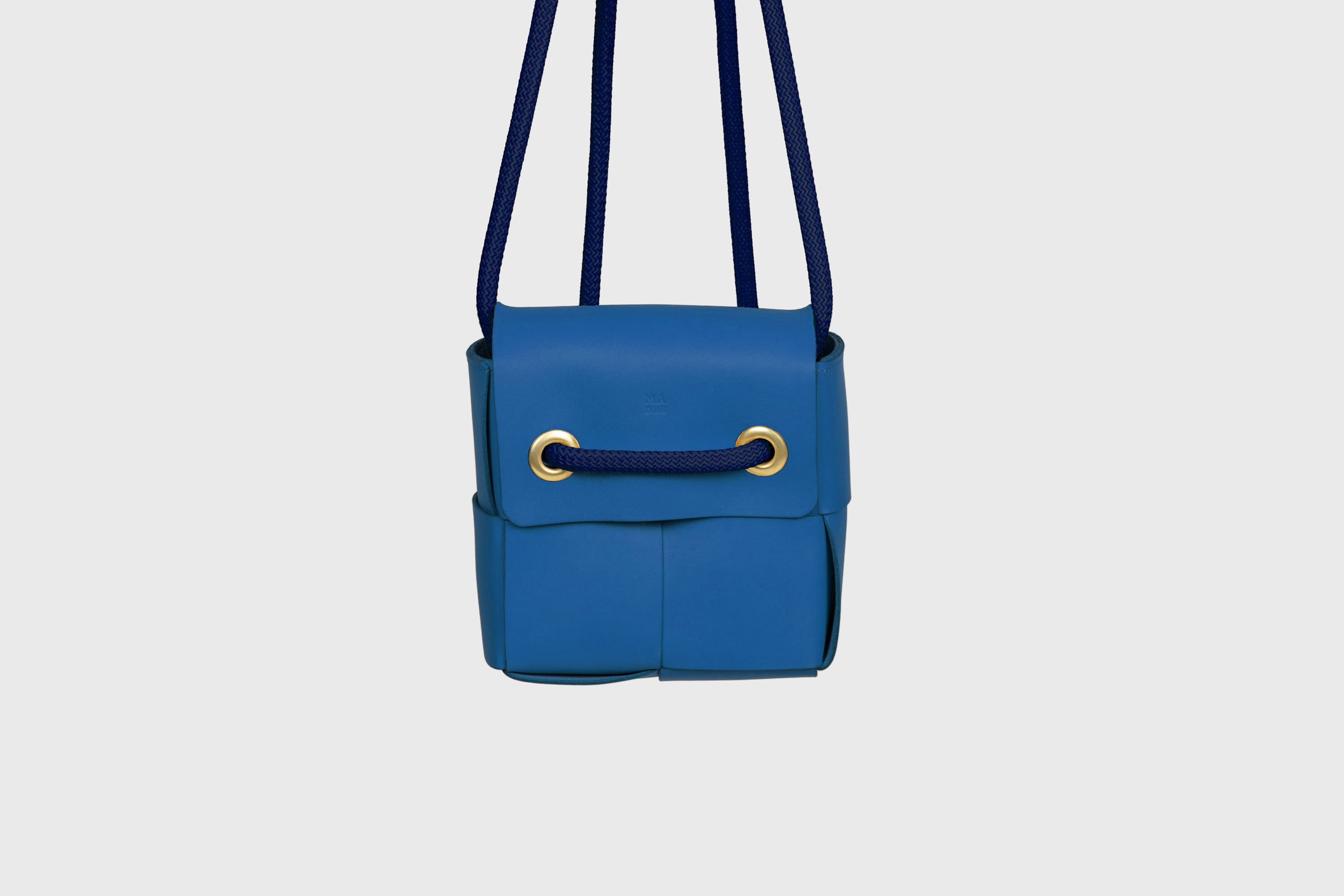 Elegant Atelier Madre Royal Blue Color woven leather backpack, designed by Manuel Dreesmann, showcasing exquisite craftsmanship and luxury style, crafted in the heart of Barcelona.