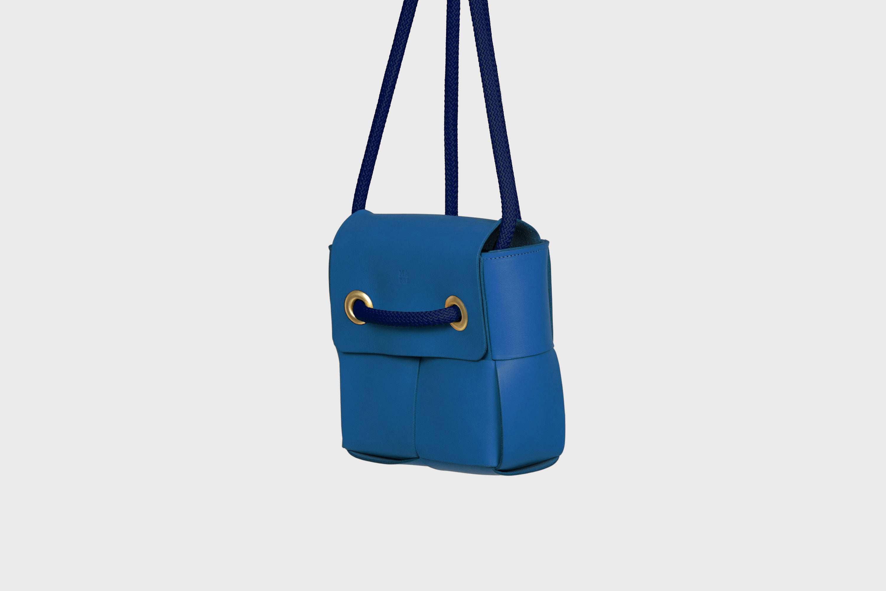 Elegant Atelier Madre Royal Blue Color woven leather backpack, designed by Manuel Dreesmann, showcasing exquisite craftsmanship and luxury style, crafted in the heart of Barcelona.