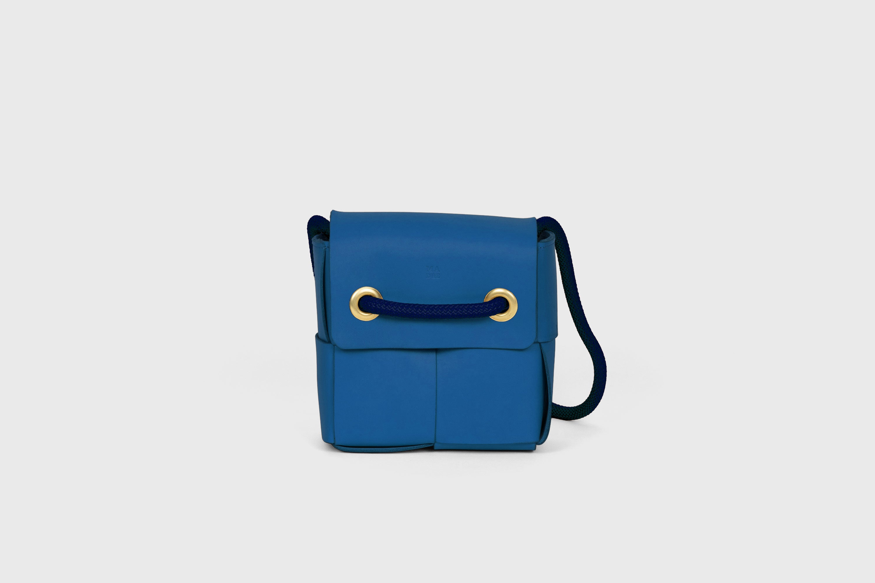 Elegant Atelier Madre Royal Blue Color woven leather backpack, designed by Manuel Dreesmann, showcasing exquisite craftsmanship and luxury style, crafted in the heart of Barcelona.