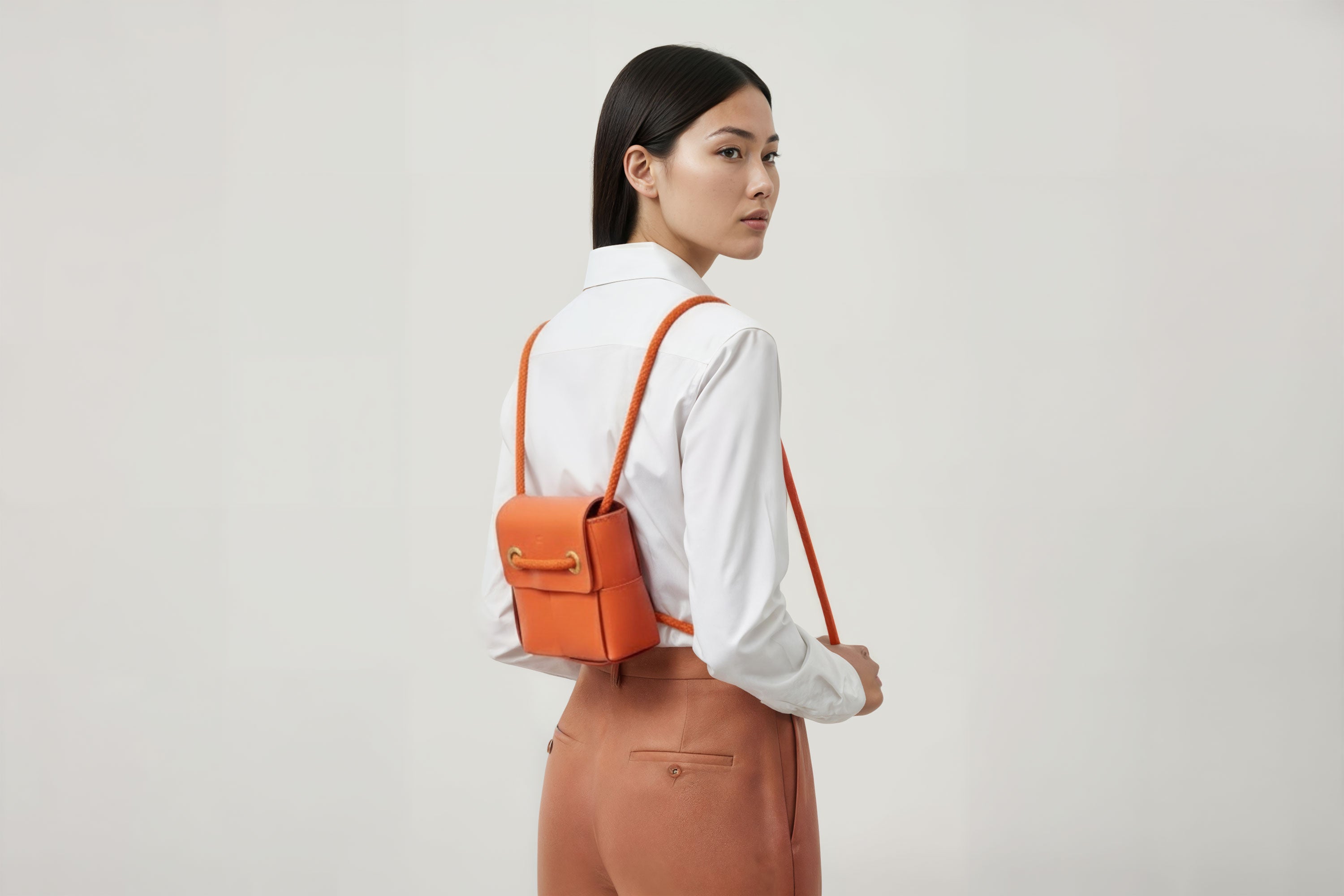 Woven Backpack Small Orange Leather On Model Minimalistic Design Atelier Madre Manuel Dreesmann Barcelona 