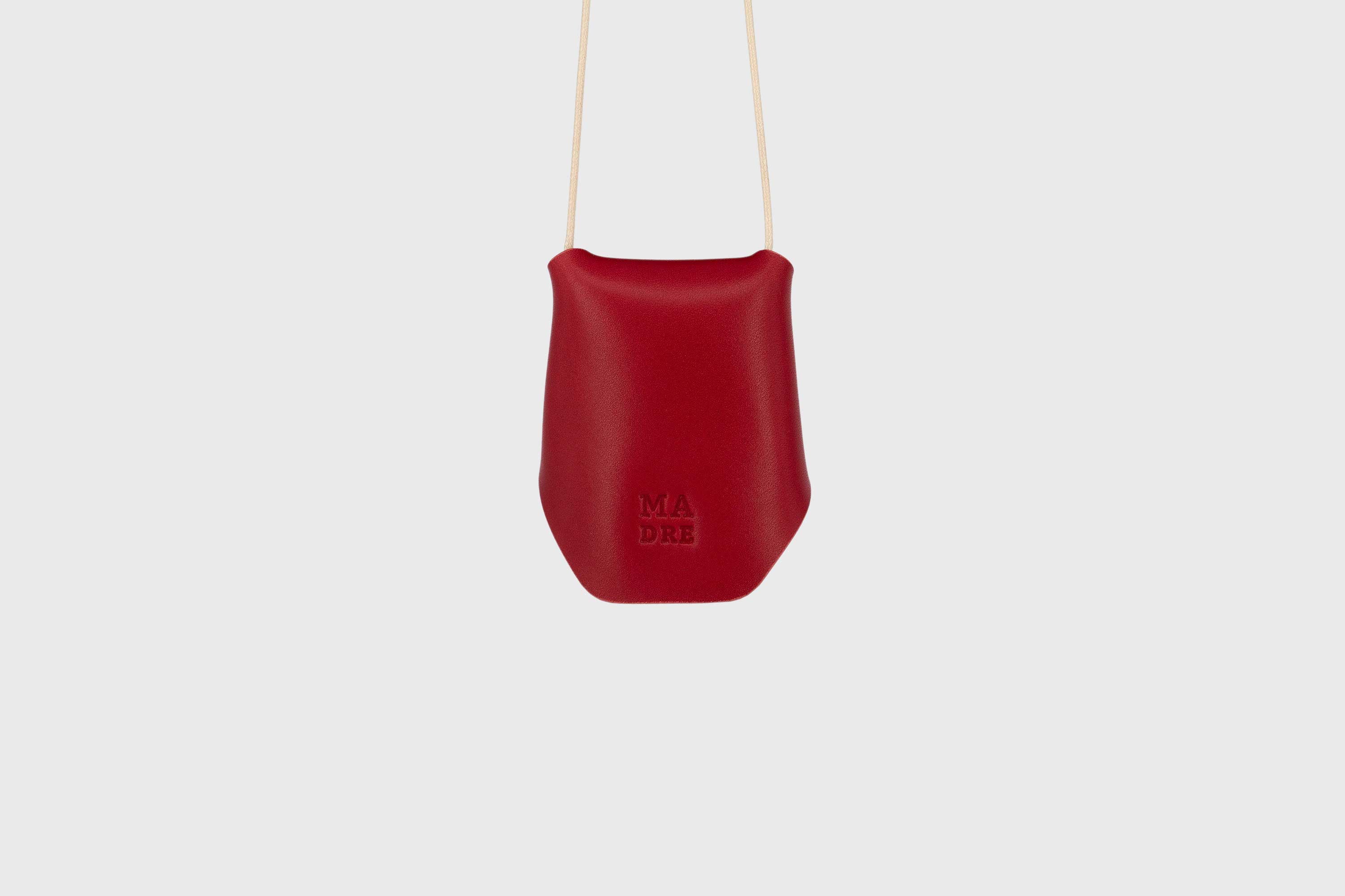 Keyhanger red color pouch leather clochette made out of vegetable tanned leather designed by atelier madre manuel dreesmann barcelona