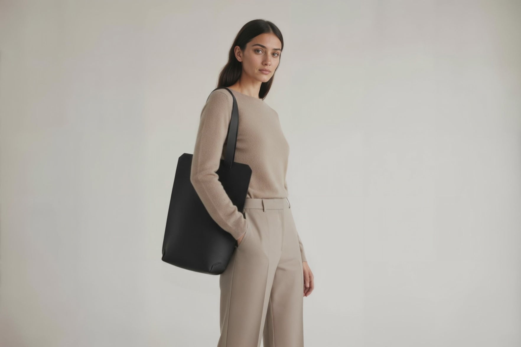 Tote Bag Long Black Color Leather Bag On A Woman Model Vegetable Tanned Leather Exclusive Quality Craftsmanship Handmade Design By Manuel Dreesmann Atelier Madre Barcelona Spain