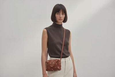 Rivet Bag Small Leather Dark Brown Color Clutch On Model Video Loop Walk Crossbody Shoulder Detachable Full Brass Vegetable Tanned Full Grain Leather High Quality Modern Minimalistic Design Atelier Madre Manuel Dreesmann Barcelona Spain
