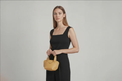 Mini Tote Bag Brown Color Leather Handbag On A Woman Model Small Modern Minimalist Design Premium Quality Atelier Madre Manuel Dreesmann Barcelona Spain