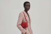 Brick Bag Red Color Leather On Model Bright Background Vegetable Tanned Leather Loop Video Modern Minimalist Design Premium Quality Atelier Madre Manuel Dreesmann Barcelona Spain