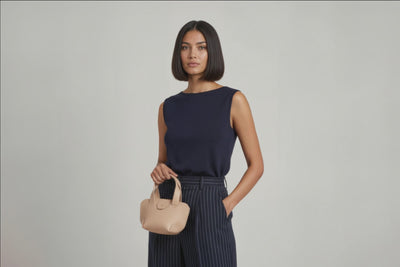 Mini Tote Bag Natural Color Leather Handbag On A Woman Model Small Modern Minimalist Design Premium Quality Atelier Madre Manuel Dreesmann Barcelona Spain