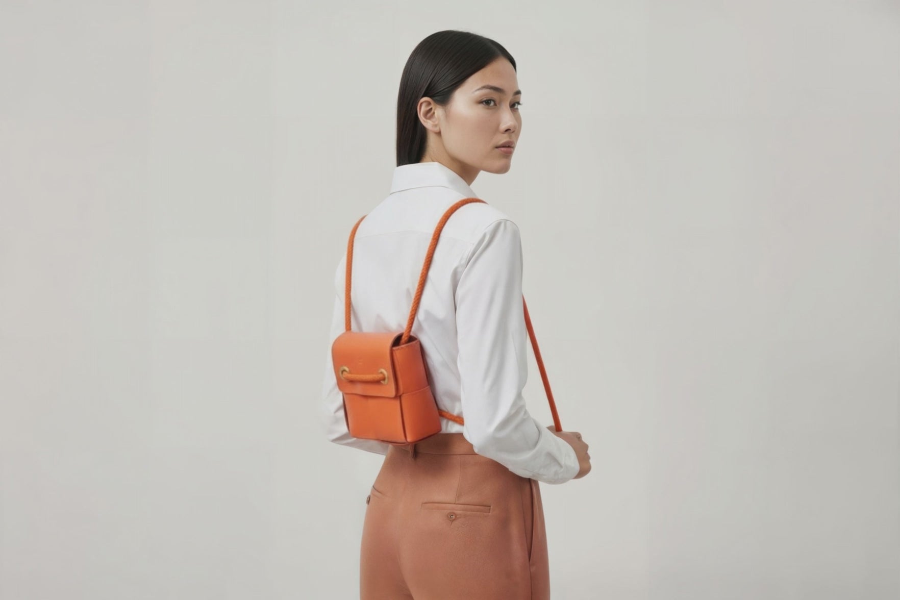 Woven Backpack Small Orange Leather On Model Minimalistic Design Atelier Madre Manuel Dreesmann Barcelona 