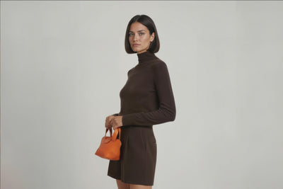 Mini Tote Bag Orange Color Leather Handbag On A Woman Model Small Modern Minimalist Design Premium Quality Atelier Madre Manuel Dreesmann Barcelona Spain