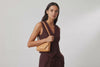 Brick Bag Brown Color Leather On Model Bright Background Vegetable Tanned Leather Loop Video Modern Minimalist Design Premium Quality Atelier Madre Manuel Dreesmann Barcelona Spain