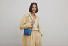 Rivet Bag Small Leather Royal Blue Color On Model Video Loop Walk Clutch Crossbody Shoulder Detachable Full Brass Vegetable Tanned Full Grain Leather High Quality Modern Minimalistic Design Atelier Madre Manuel Dreesmann Barcelona Spain