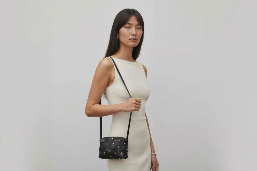 Rivet Bag Small Leather Black Color Clutch Crossbody Shoulder On Model Video Loop Walk Detachable Full Brass Vegetable Tanned Full Grain Leather High Quality Modern Minimalistic Design Atelier Madre Manuel Dreesmann Barcelona Spain