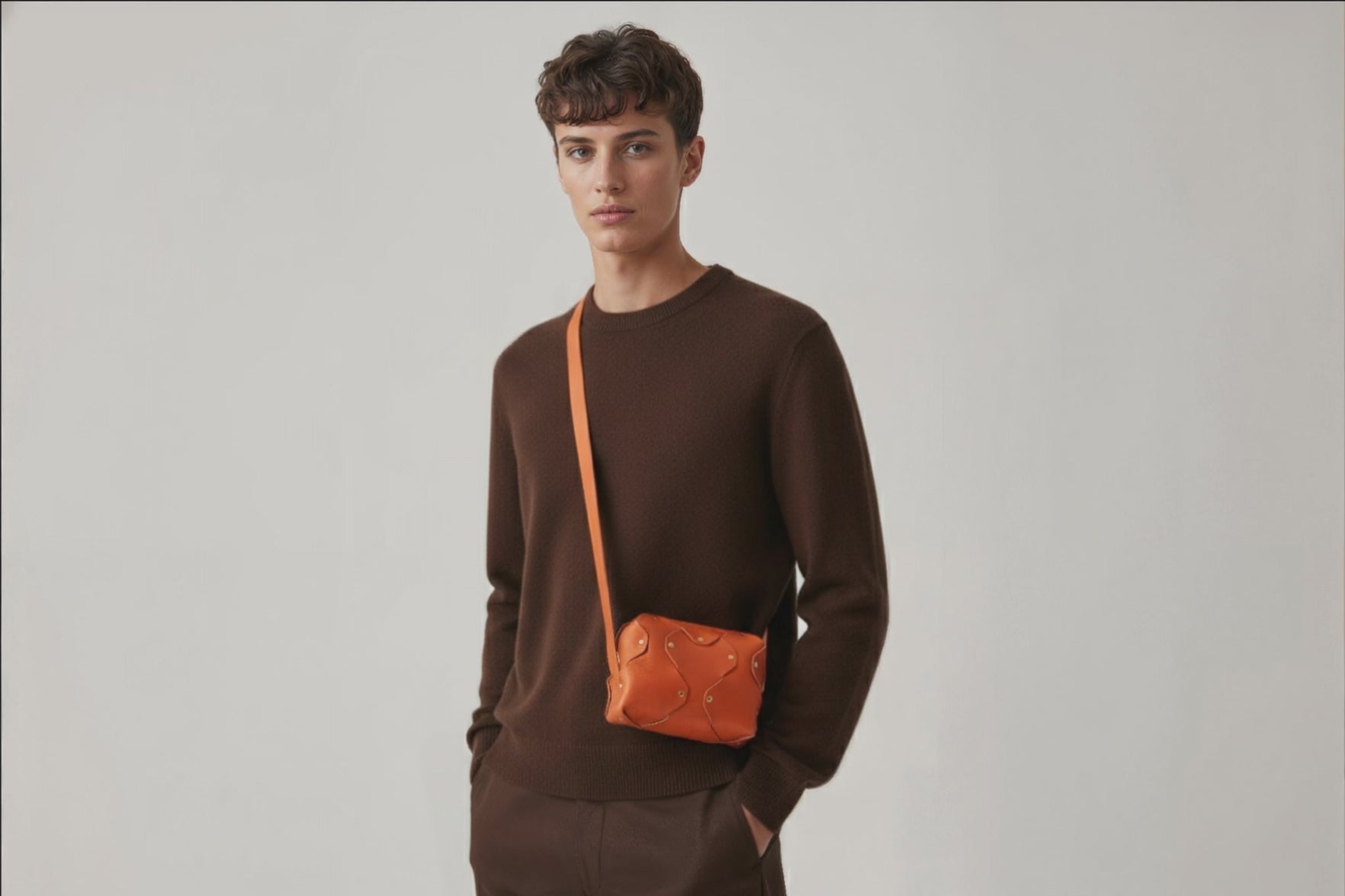 Marlin Leather Bag Small Orange Color On A Man Model Premium Quality Minimalist Design Atelier Madre Manuel Dreesmann Barcelona Spain
