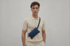Belt Bag Leather Marine Blue Color On A Man Model Fanny Pack Waist Bag Vegetable Tanned Leather Full Grain Premium Quality Modern Minimalist Design Atelier Madre Manuel Dreesmann Barcelona Spain